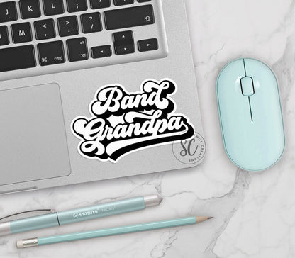 Retro Band Grandpa vinyl sticker on a silver laptop next to a mint mouse and pens