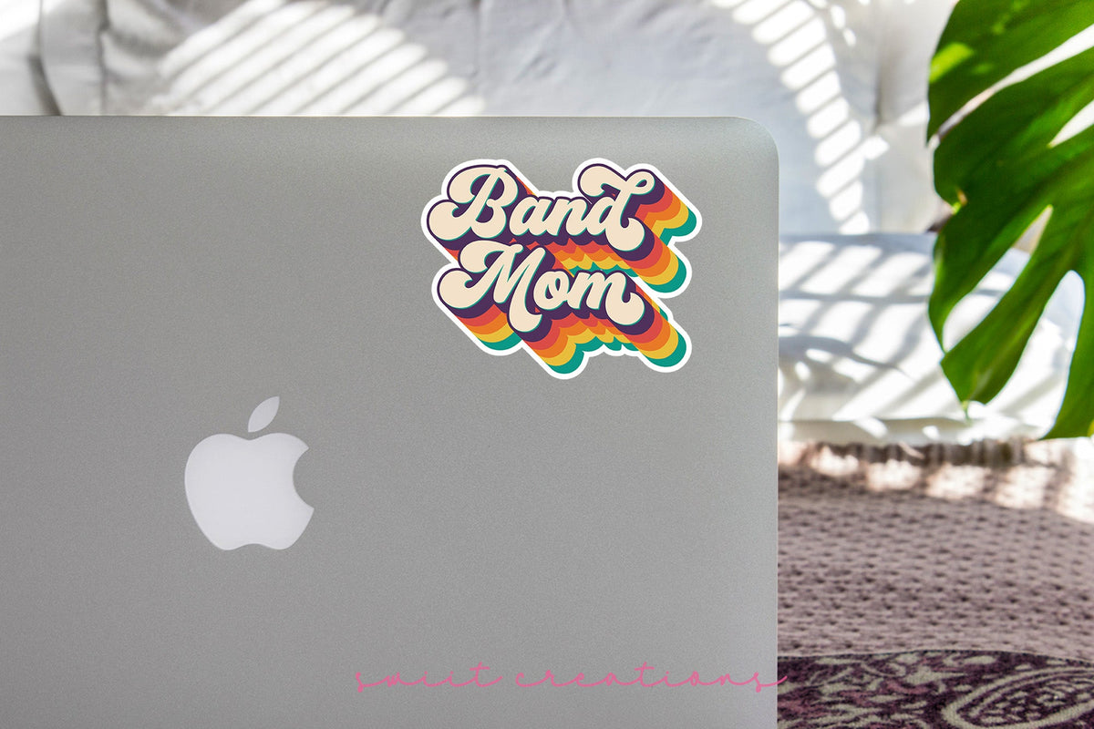 Retro Band Mom sticker on the lid of a silver laptop
