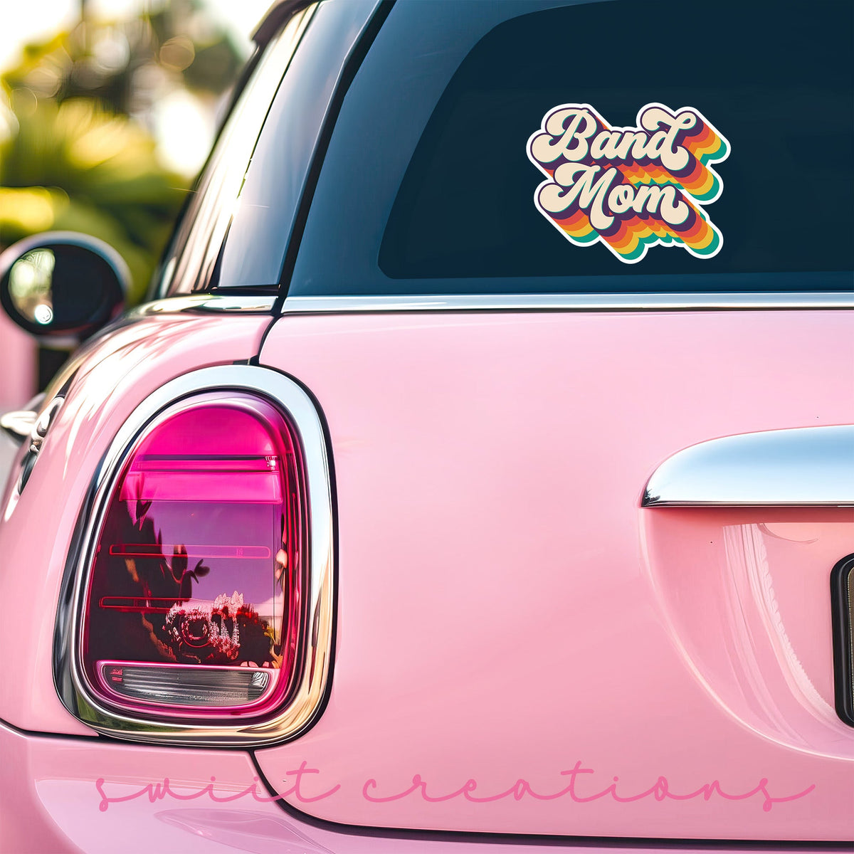 Retro Band Mom sticker on the back window of a pink car