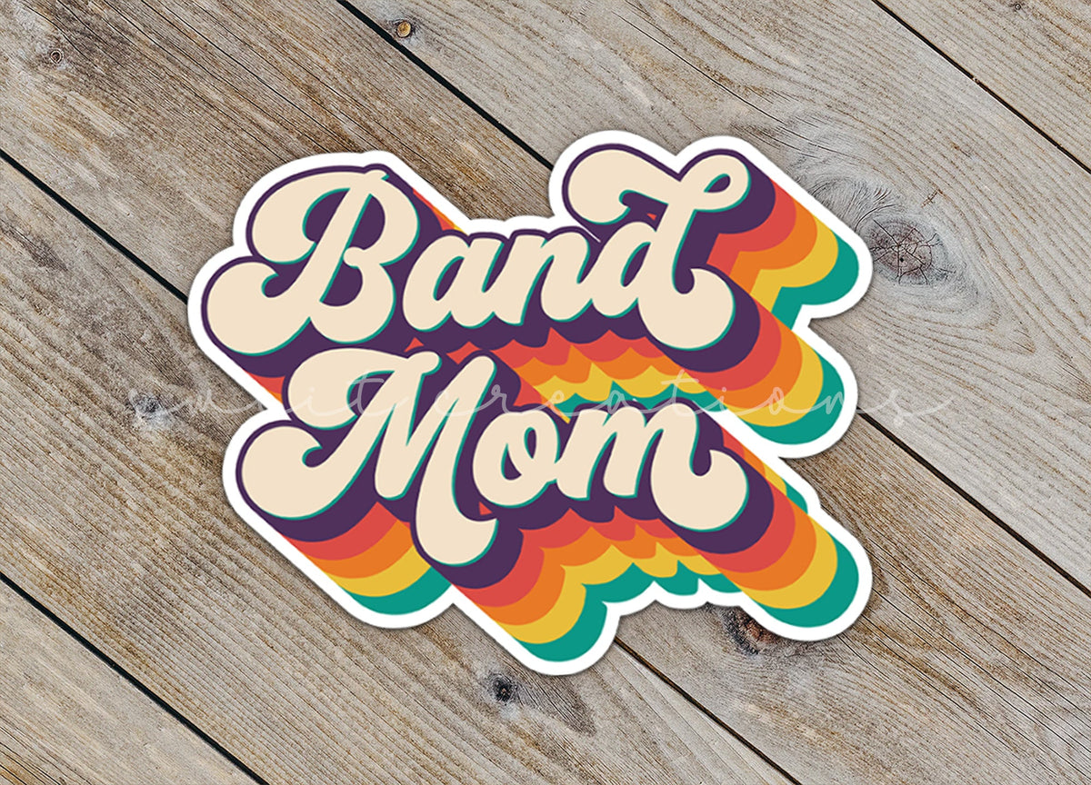Close-up of the Retro Band Mom sticker on rustic wood