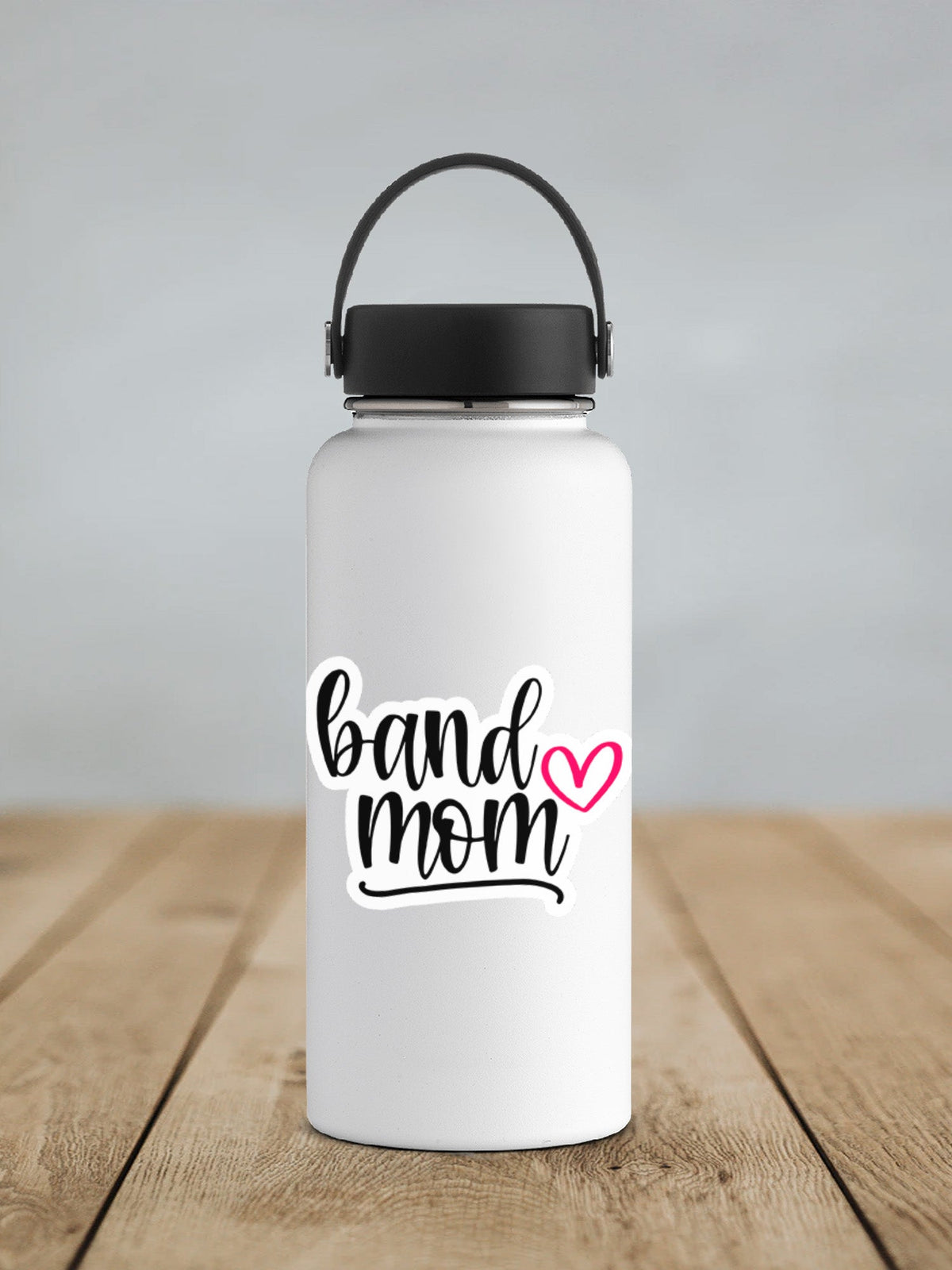Pink Heart Band Mom sticker on a white insulated water bottle