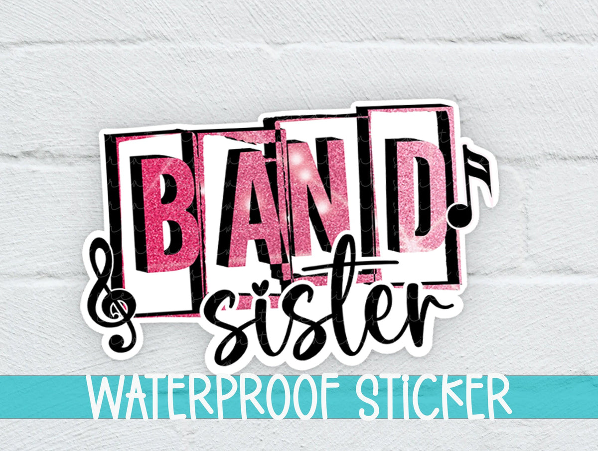 Pink Band Sister sticker on a white brick background with a waterproof sticker banner