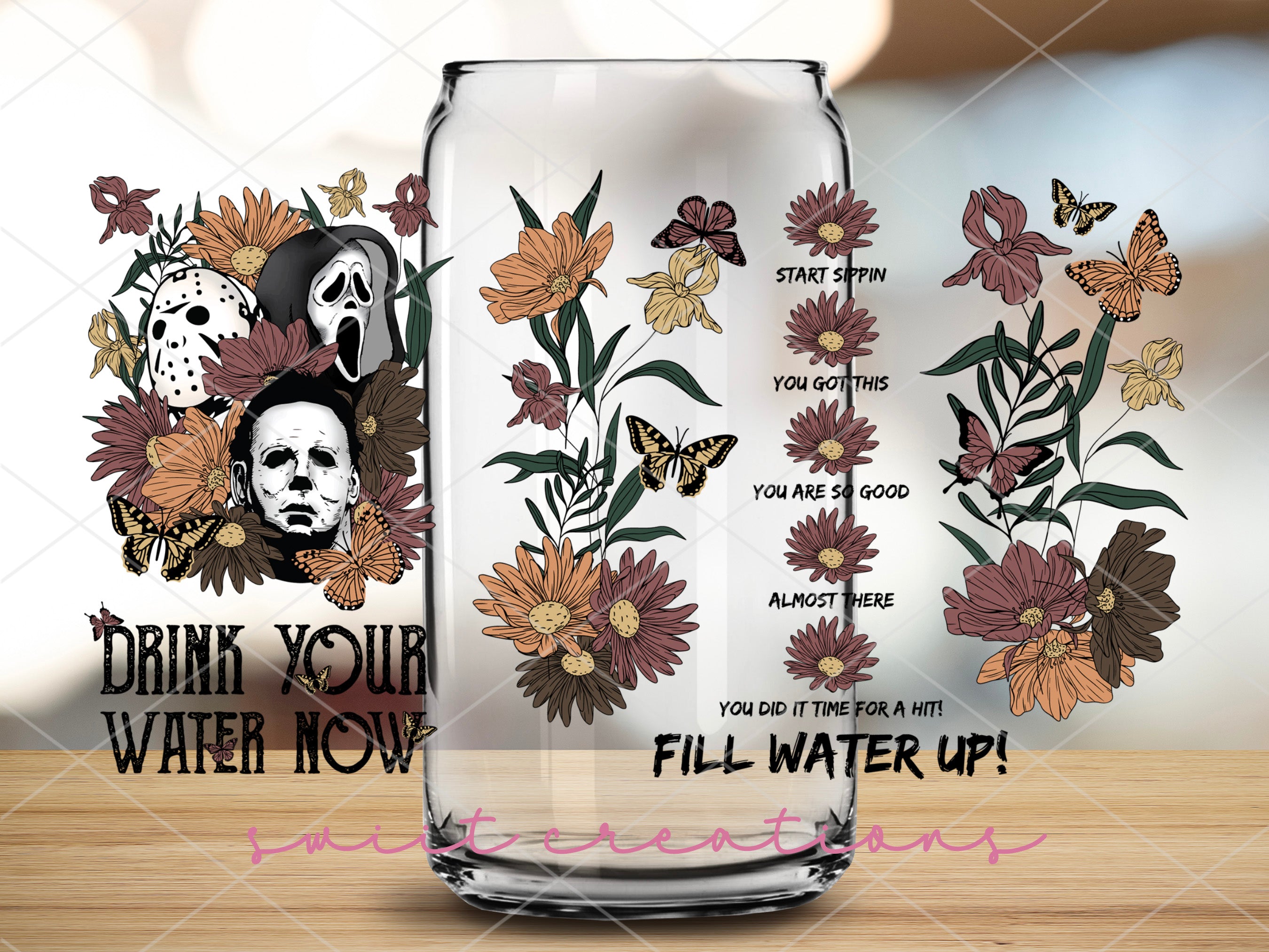 a glass jar with a picture of a skull and flowers on it