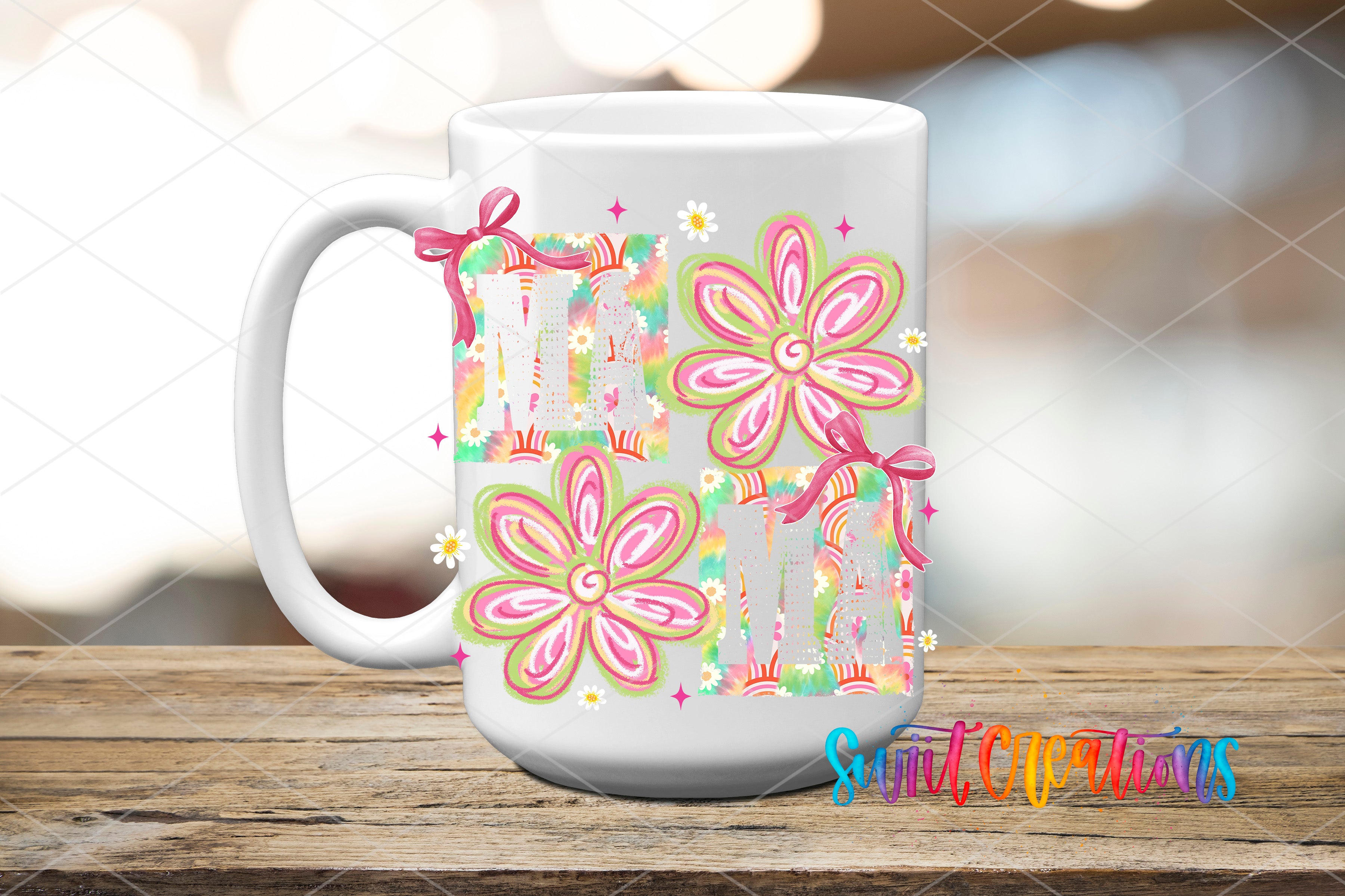 A white ceramic mug with a colorful floral design featuring pink and green flowers, along with a bow and stars, placed on a wooden surface.
