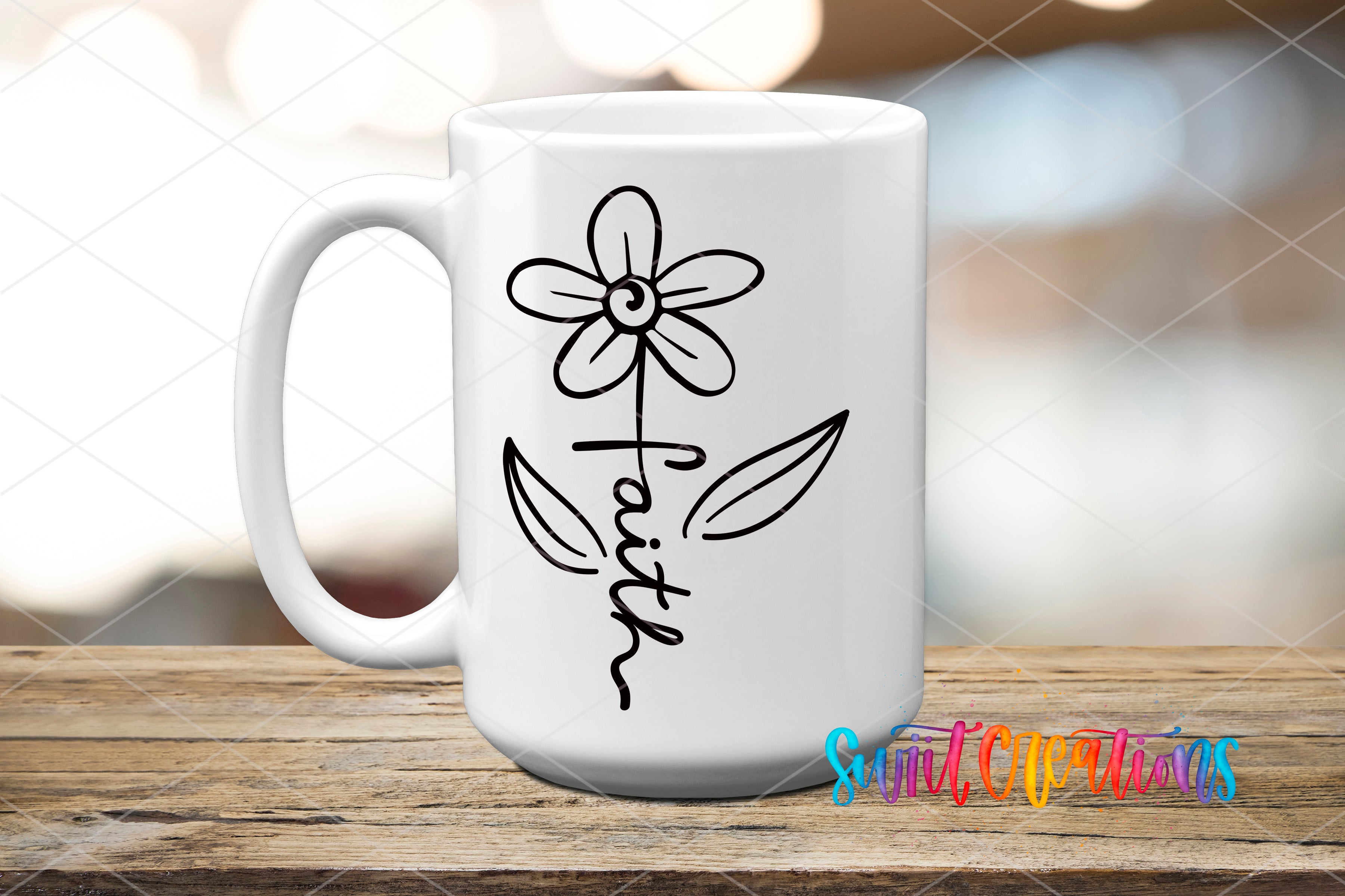 A white ceramic mug with a simple black flower design and the word "Faith" written on it, placed on a wooden surface.