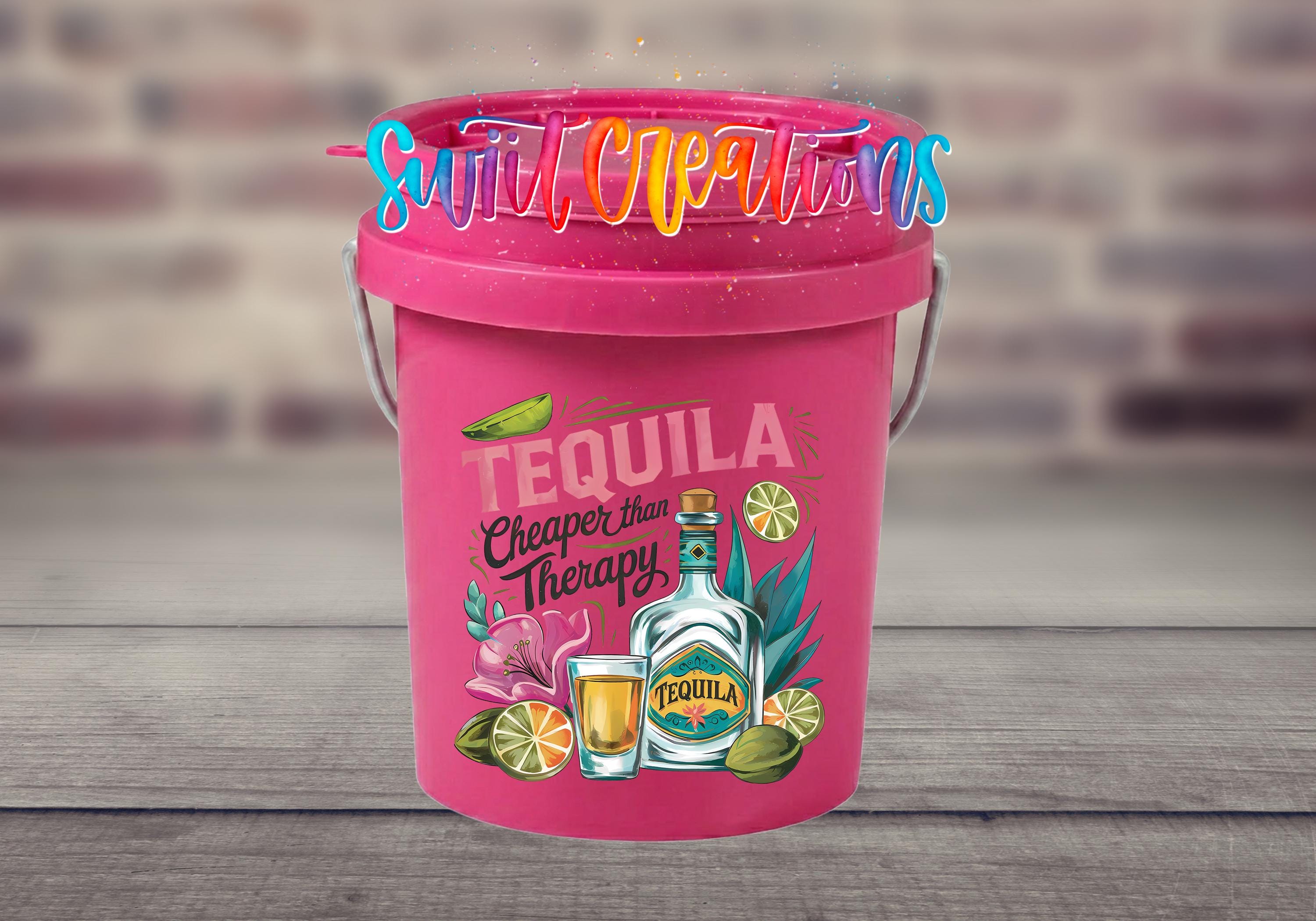 A pink bucket with a tequila-themed design, featuring a bottle of tequila, a lime, and other tequila-related items.