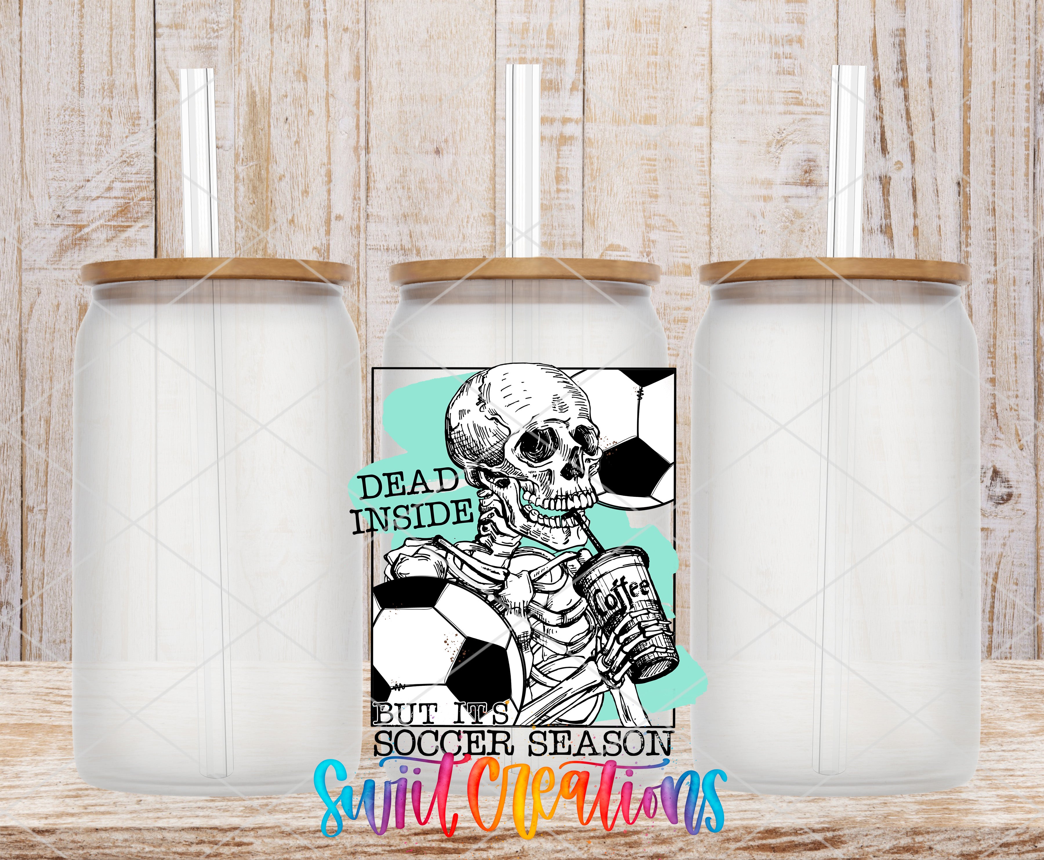 a skeleton holding a soccer ball and a cup with a straw, accompanied by the text "Dead inside but it's soccer season" and "Suitable Creations".
