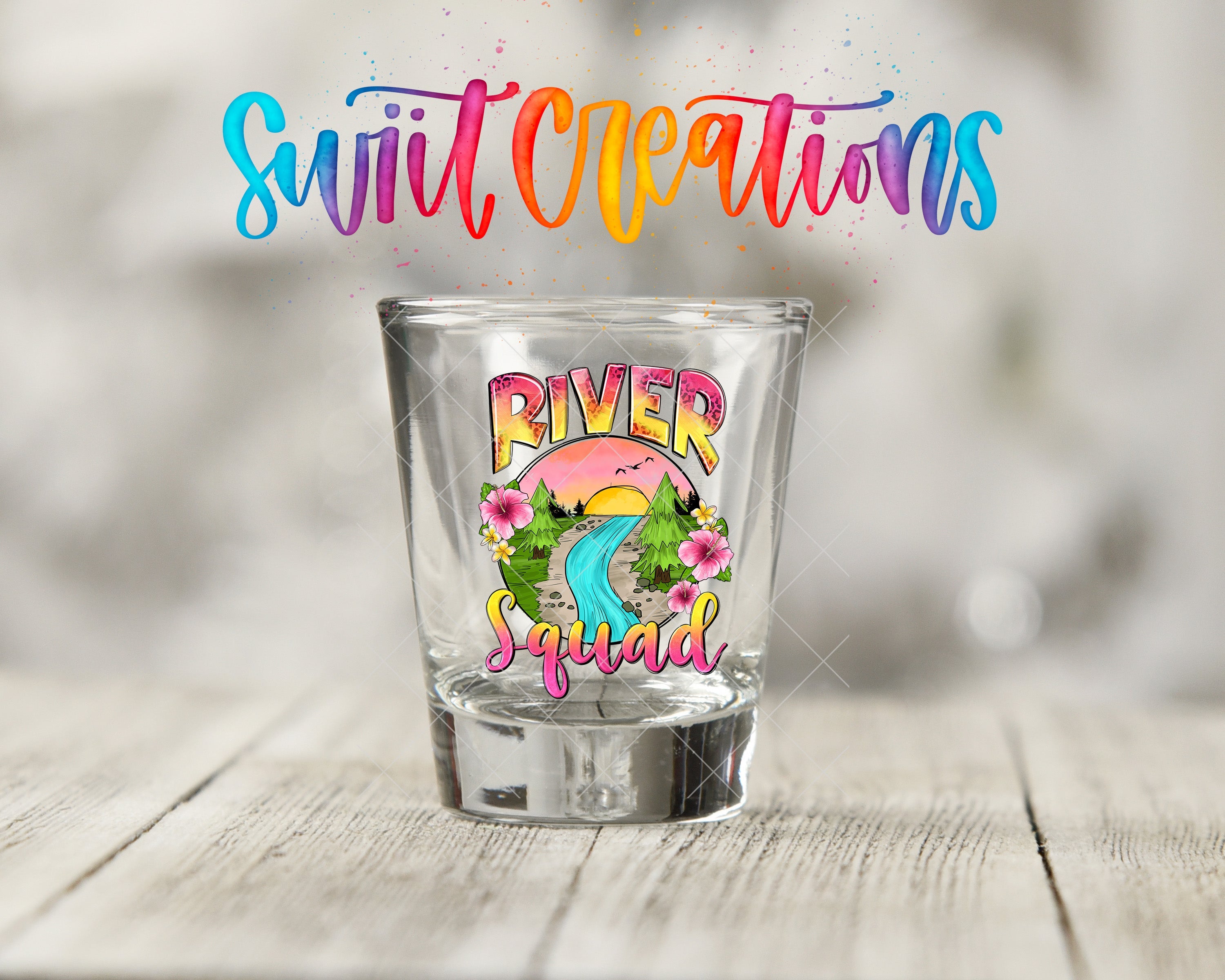 a shot glass sitting on top of a wooden table