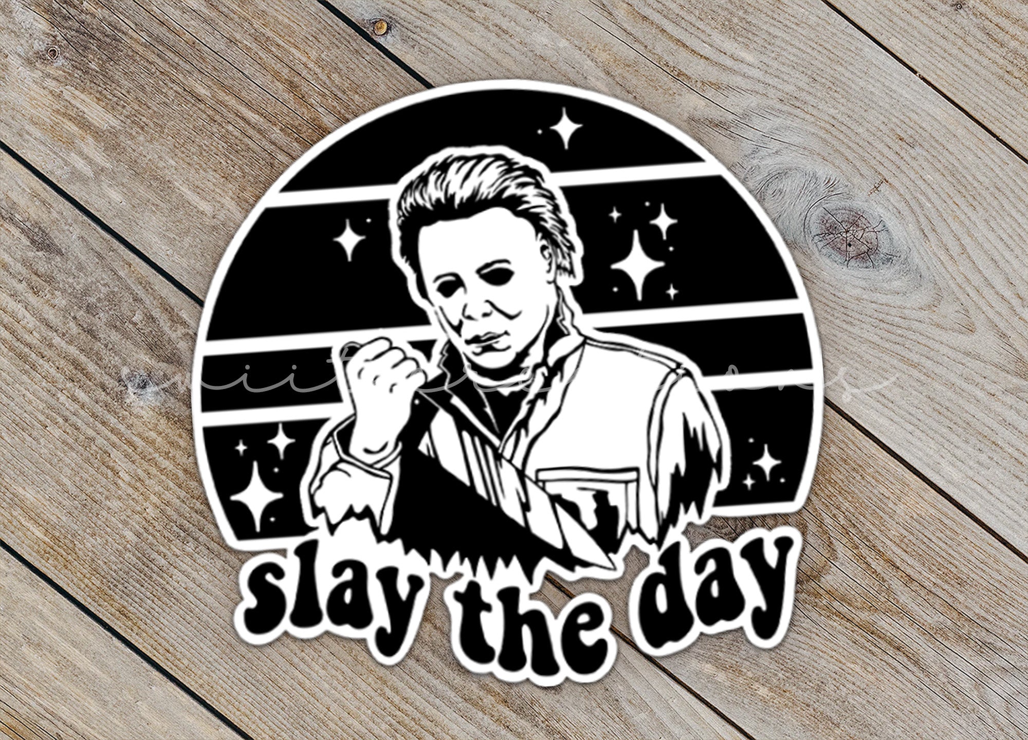 a sticker that says stay the day on a wooden surface