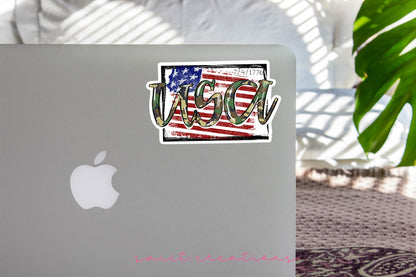 USA Camo sticker on the lid of a silver laptop