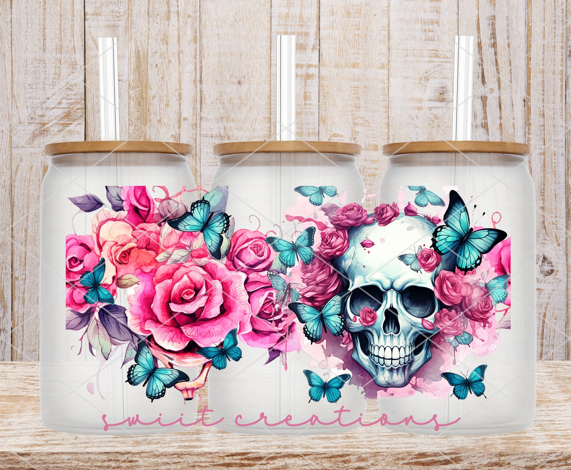 two coffee mugs with a skull and flowers on them