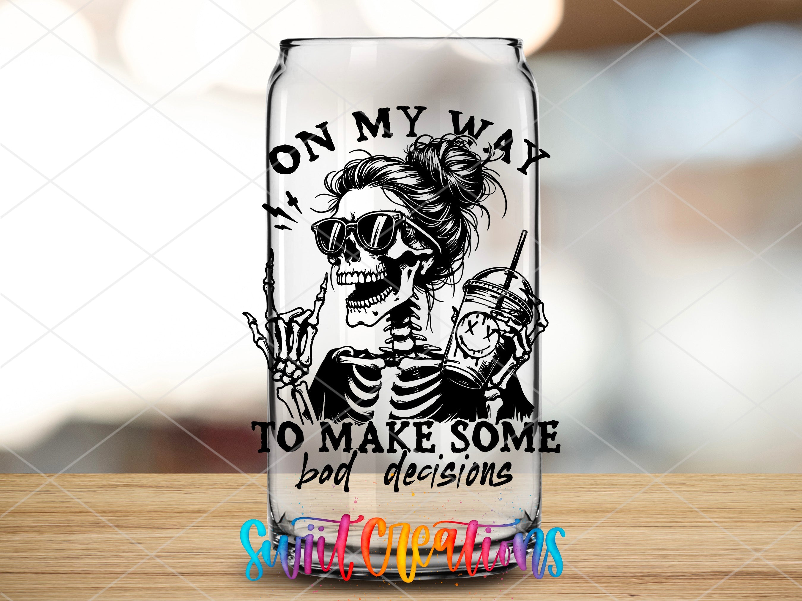 a glass with a picture of a skeleton on it