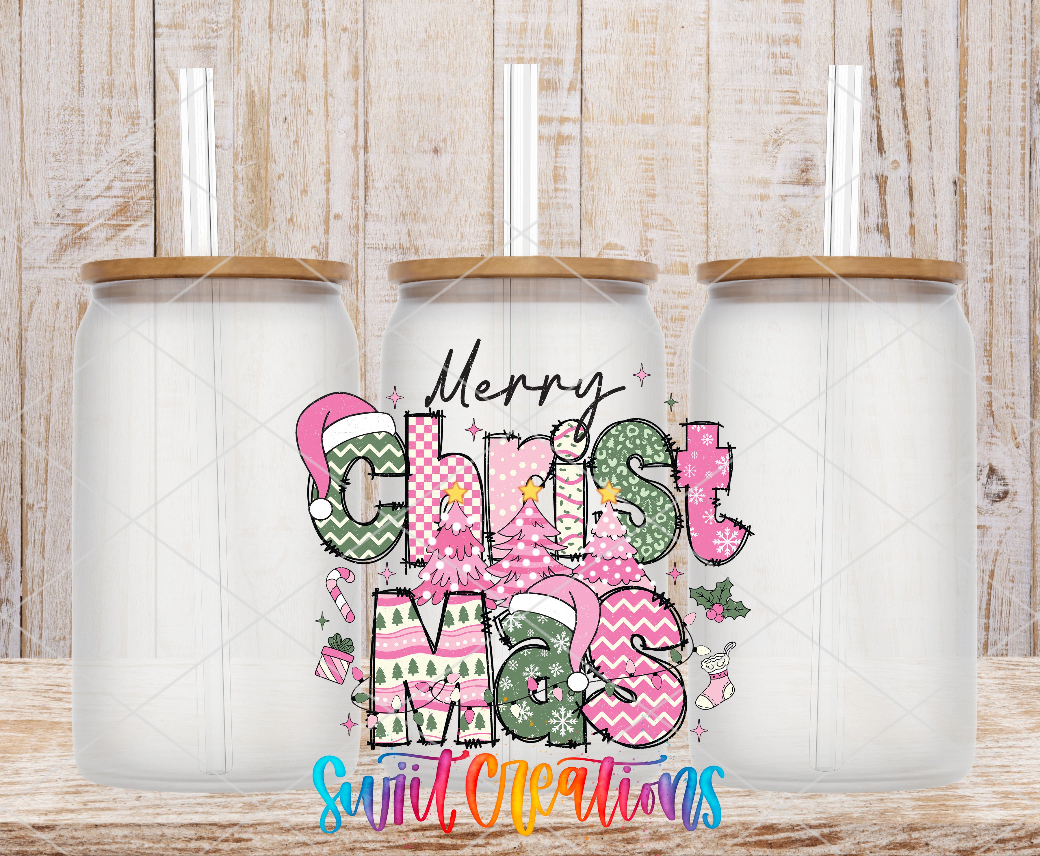 three glass jars with a festive Christmas-themed design. The jars are white with brown lids and have straws sticking out of them. The design includes colorful Christmas-themed elements such as snowflakes, pine trees, and other holiday decorations. The phrase "Merry Christmas" is prominently displayed in the center of the jars, and the text "Suitable Crafts" is written below the jars.