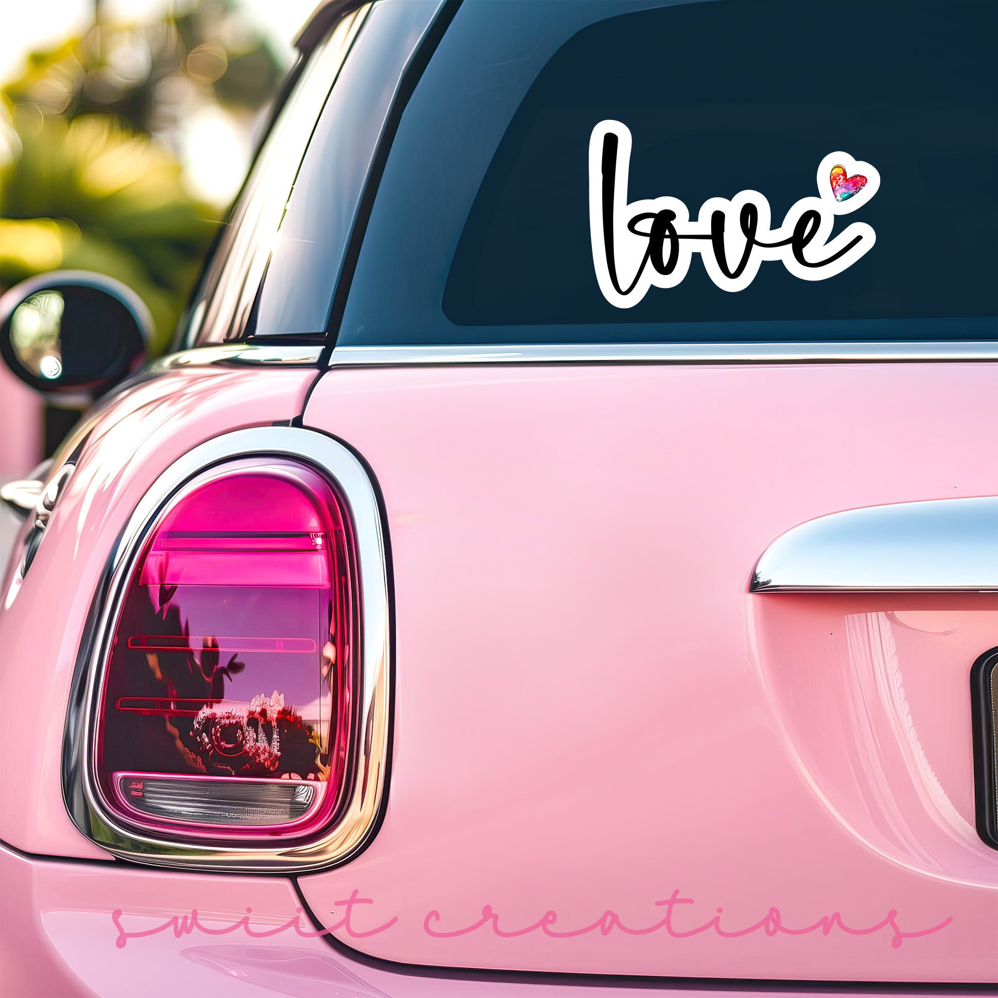 a pink car with the word love on it