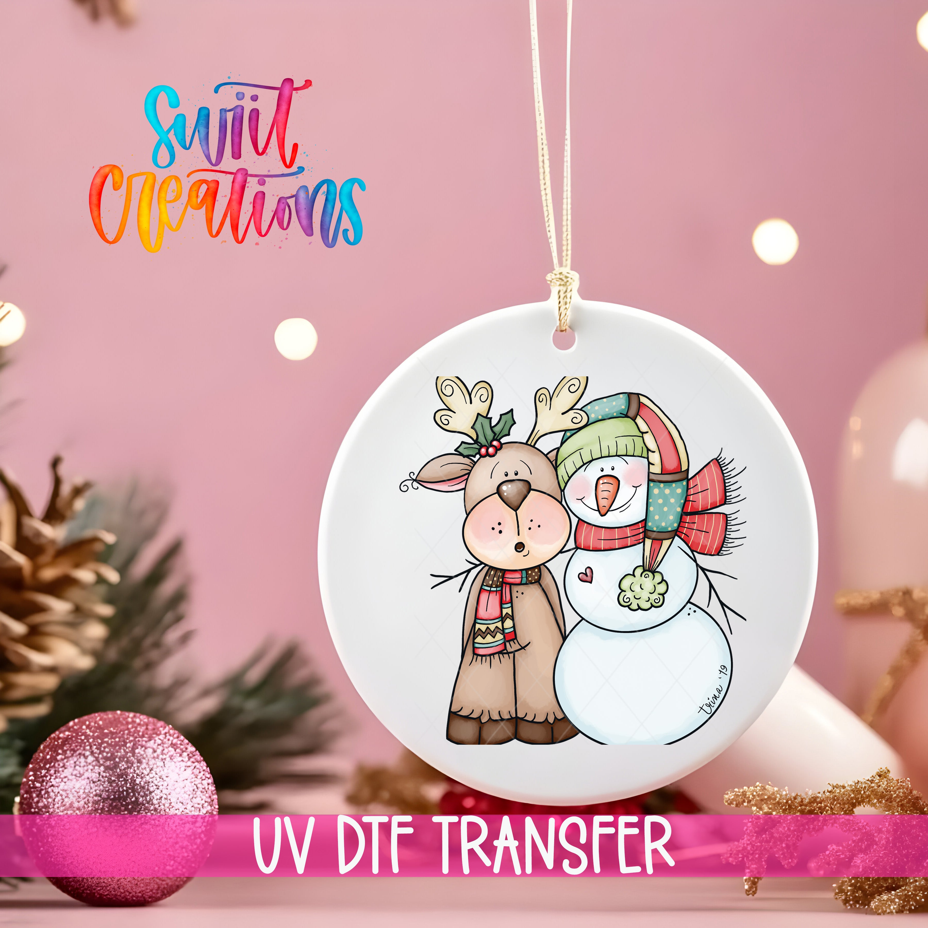 A decorative ornament featuring a snowman and a reindeer, with the text "Swift Creations" and "UV Dtf Transfer" printed on it.