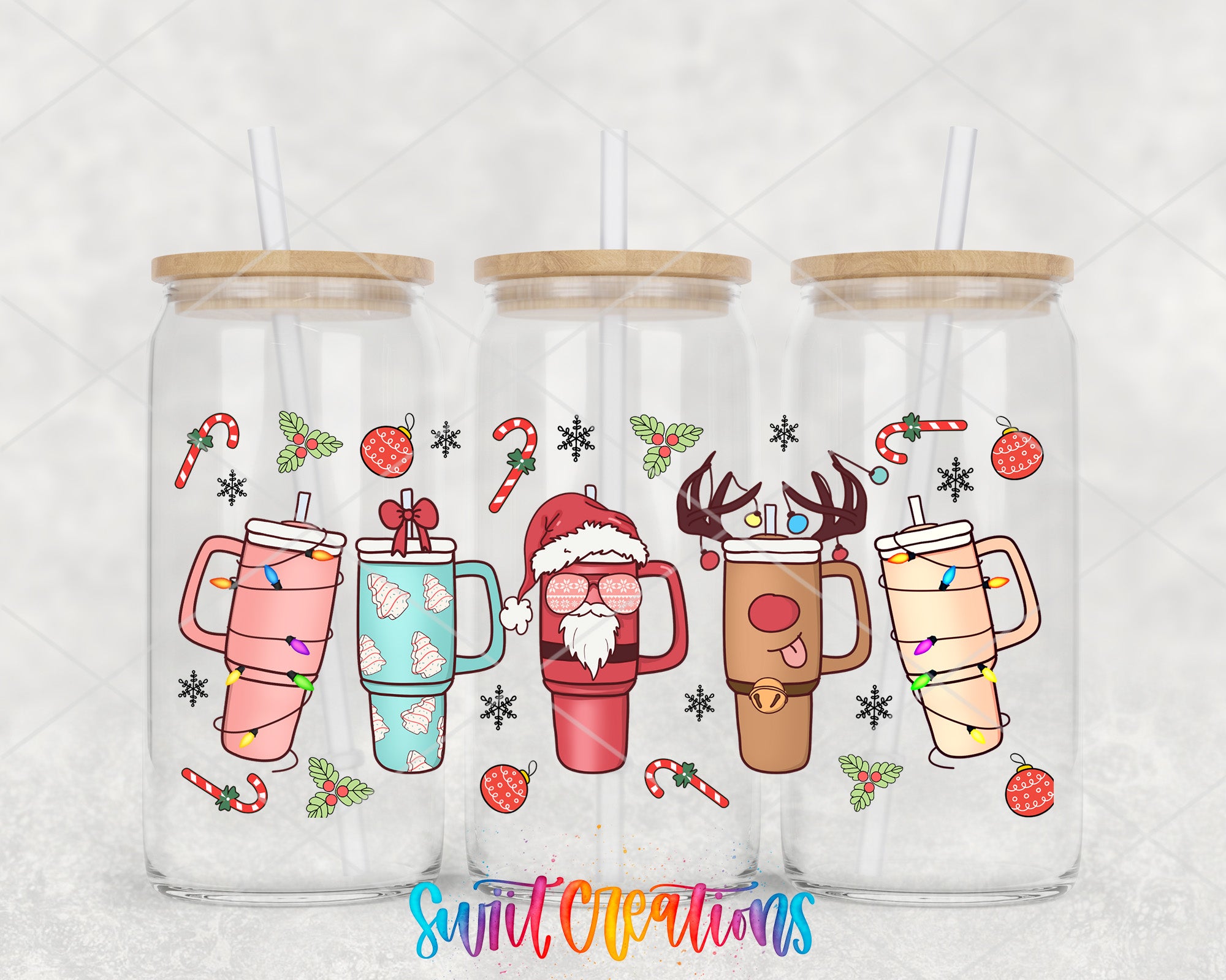 three glass mugs with christmas themed designs on them