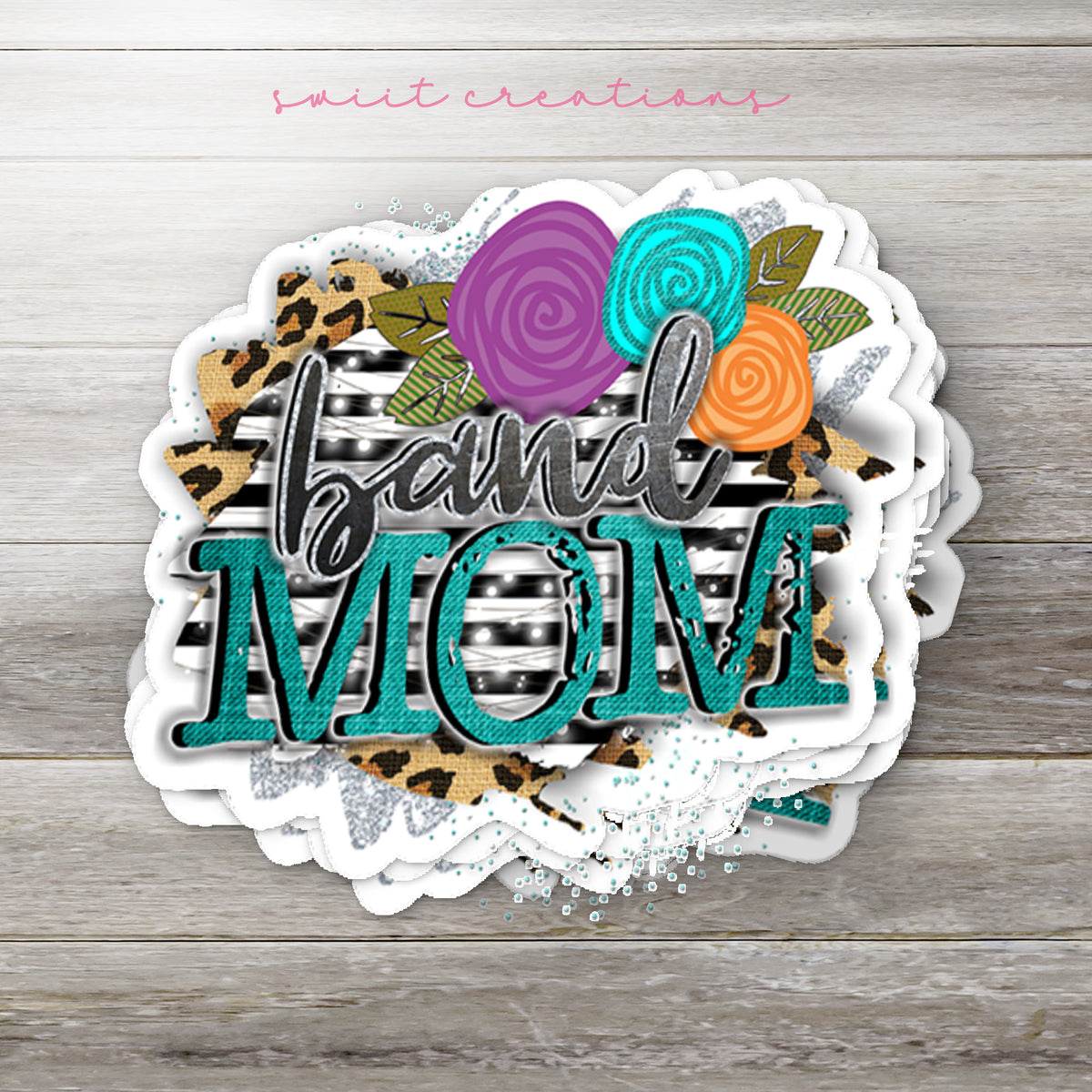 Stack of Leopard Floral Band Mom glossy stickers on a gray wood table