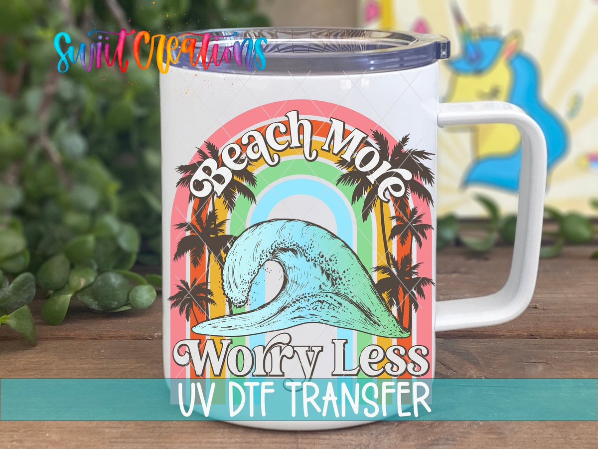Beach More Worry Less retro rainbow wave UV DTF transfer on a white stainless steel mug with a lid