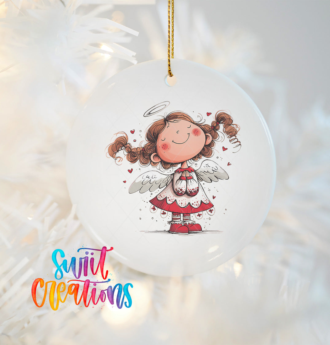A white ceramic ornament featuring a smiling cartoon girl with curly hair and wings, hanging on a string.