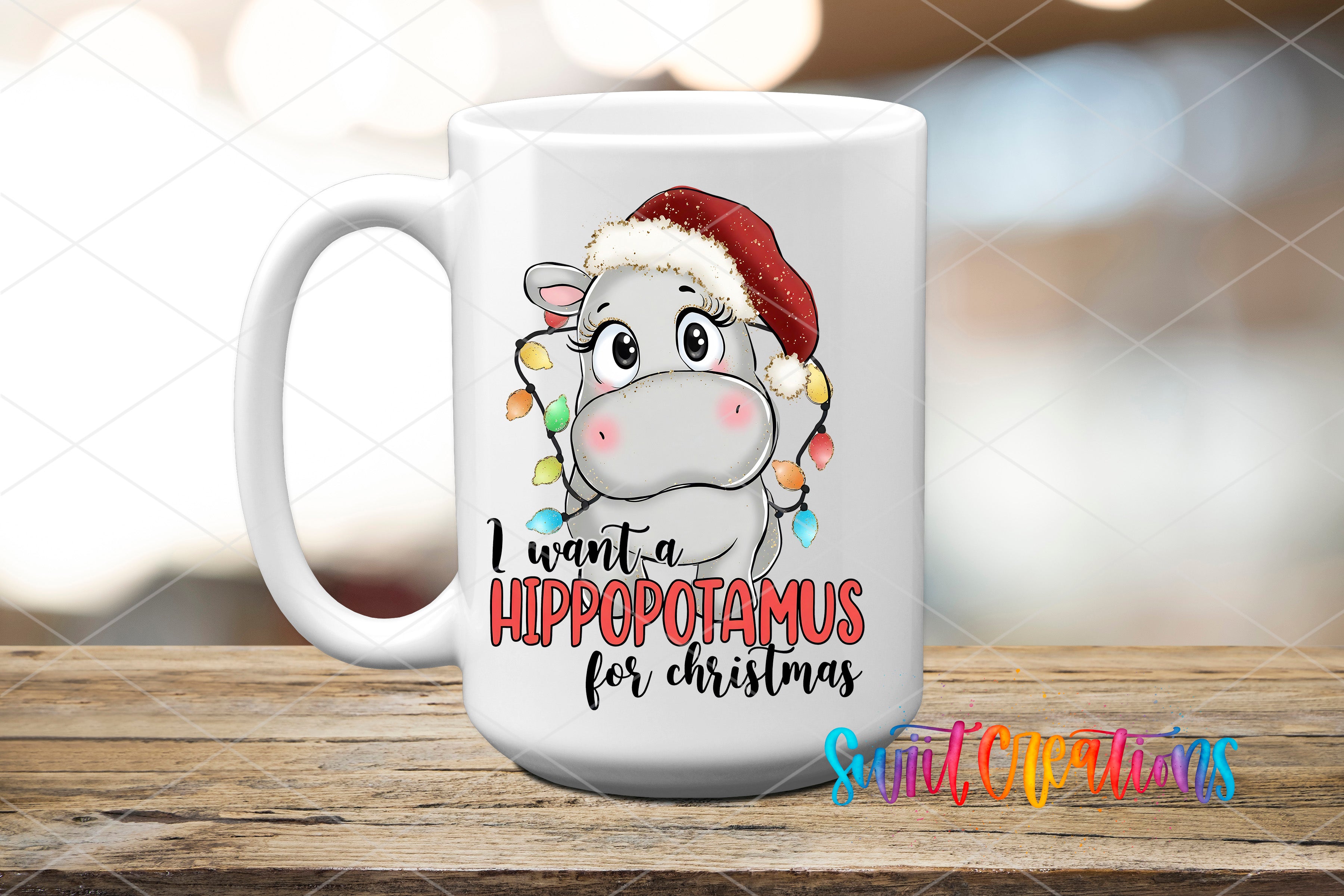 A white ceramic mug with a cartoon image of a hippopotamus wearing a Santa hat and the text "I want a Hippopotamus for Christmas" printed on it.