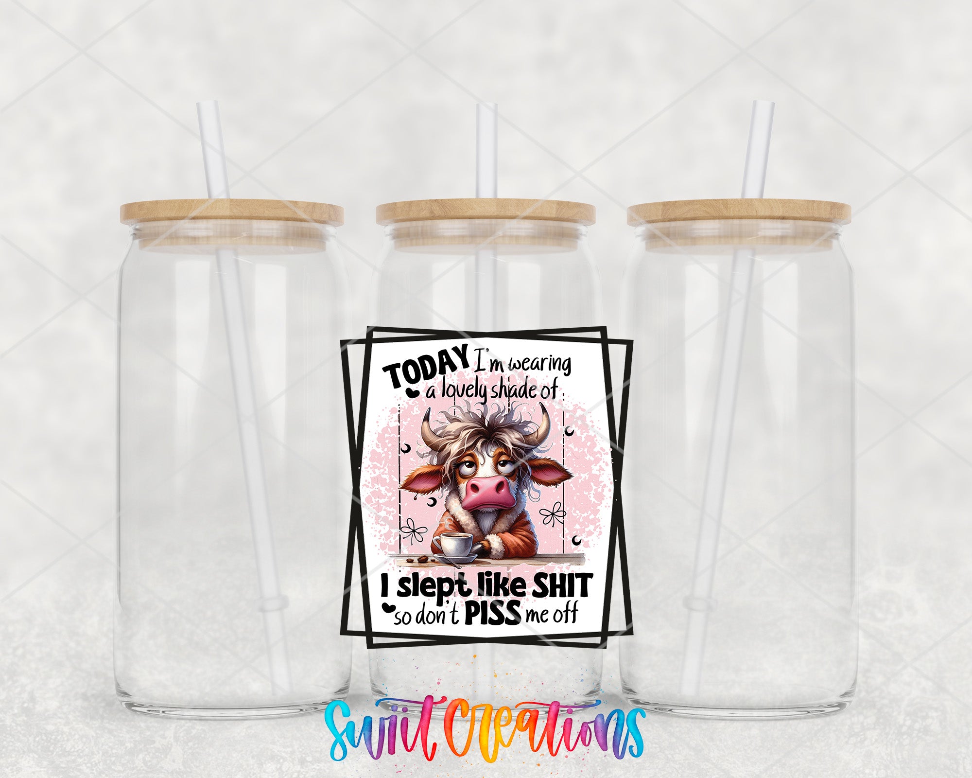 two clear tumblers with a picture of a cow on them