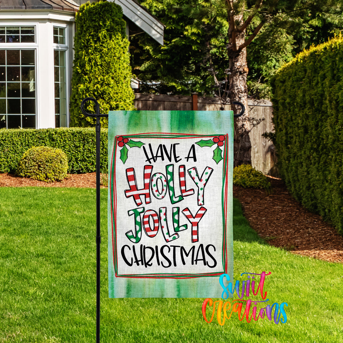 A yard sign with the text "Have a Holly Jolly Christmas" displayed on it, placed in a grassy area with a house and trees in the background.
