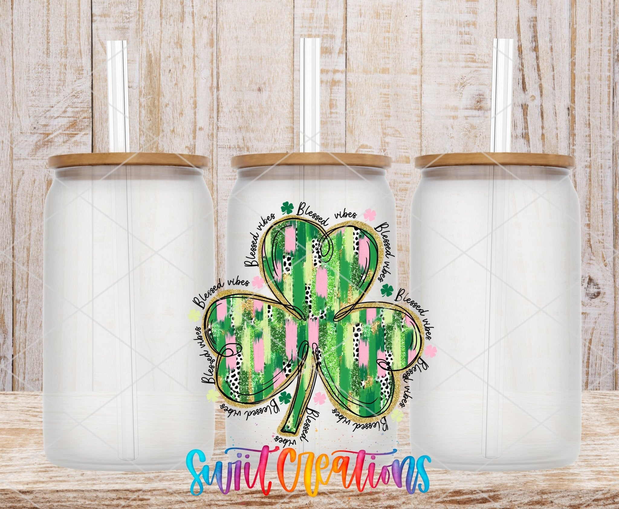 Swiit Creations UV DTF Blessed Vibes Clover transfer shown on a clear glass can set