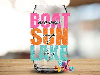 Close-up of the Boat Sun Lake UV DTF transfer on a clear glass can