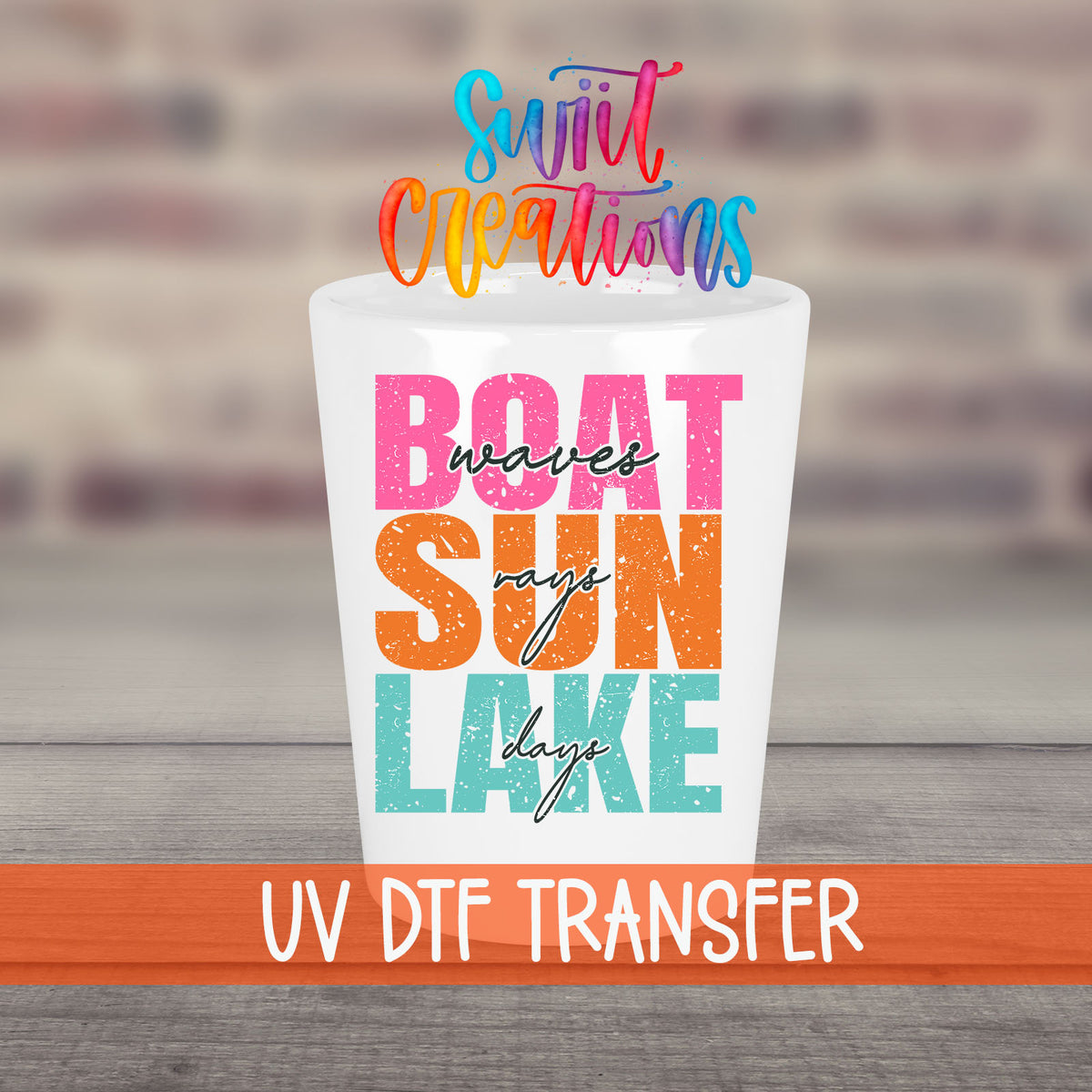 Boat Waves Sun Rays Lake Days UV DTF transfer on a white shot glass in front of a brick wall