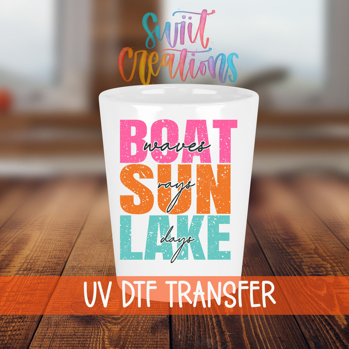 Boat Waves Sun Rays Lake Days shot glass transfer on a white shot glass on a wooden table