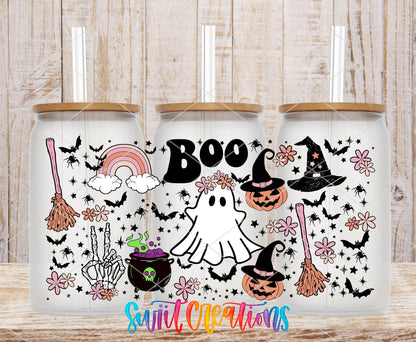Boo UV DTF wrap on three clear glass cans with bamboo lids