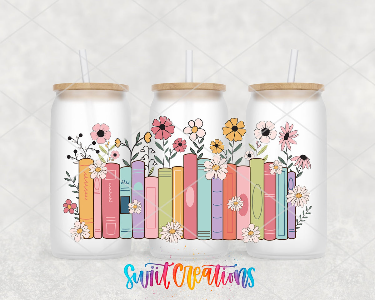 Books and Flowers UV DTF wrap on three frosted glass cans