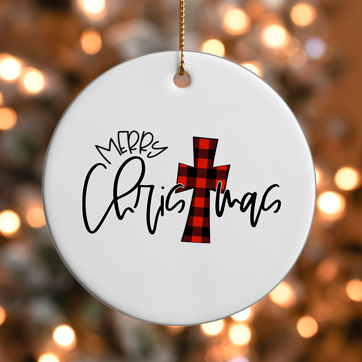 Buffalo Plaid Cross Merry Christmas ornament UV DTF transfer on a round white ornament with a bokeh light background