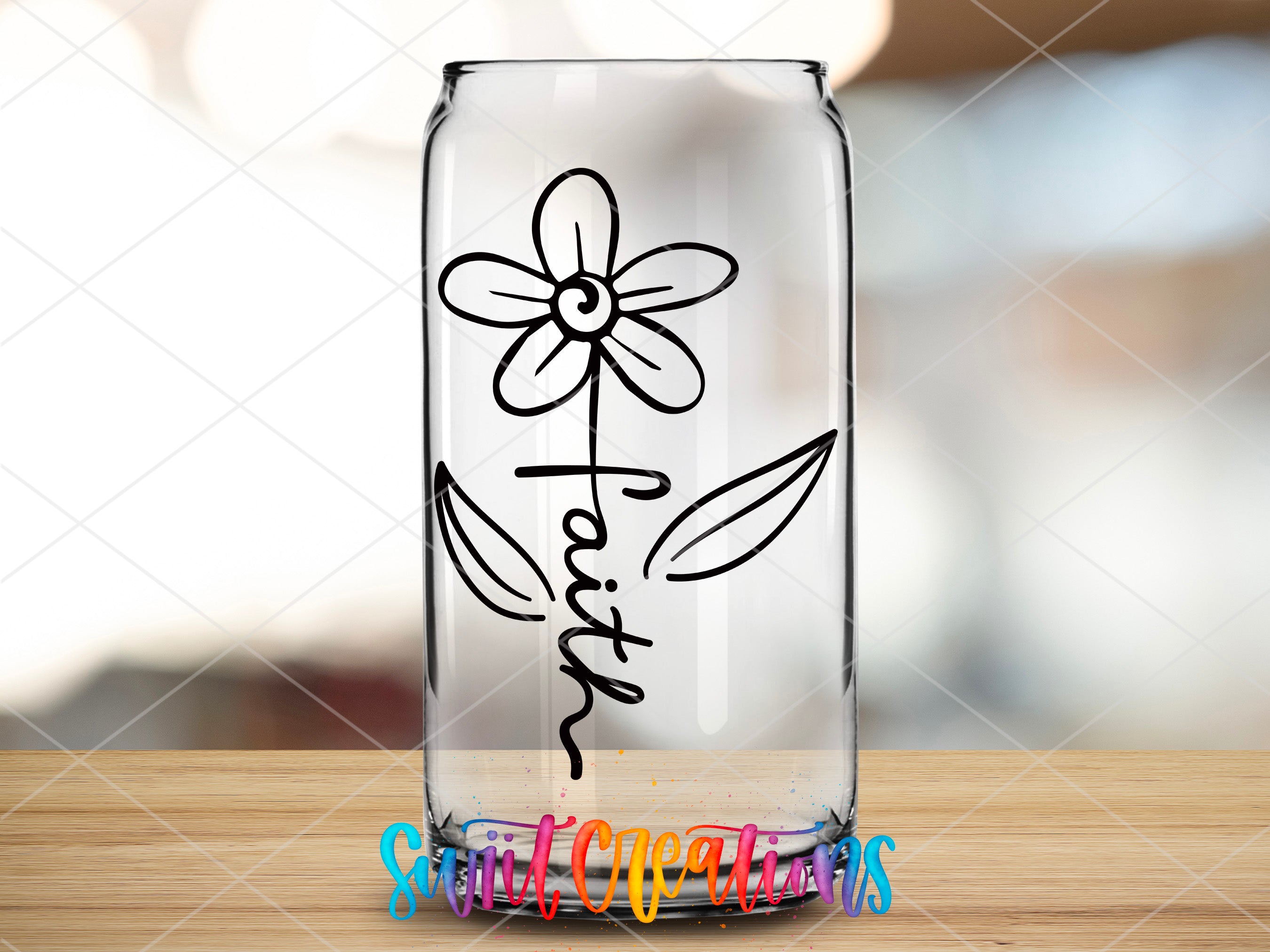 a glass vase with a flower drawn on it