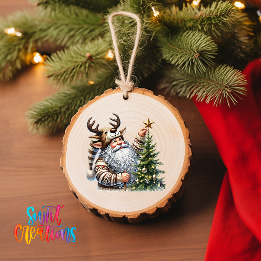 A wooden ornament featuring a Santa Claus figure holding a Christmas tree, with a star on top, is hanging on a Christmas tree.