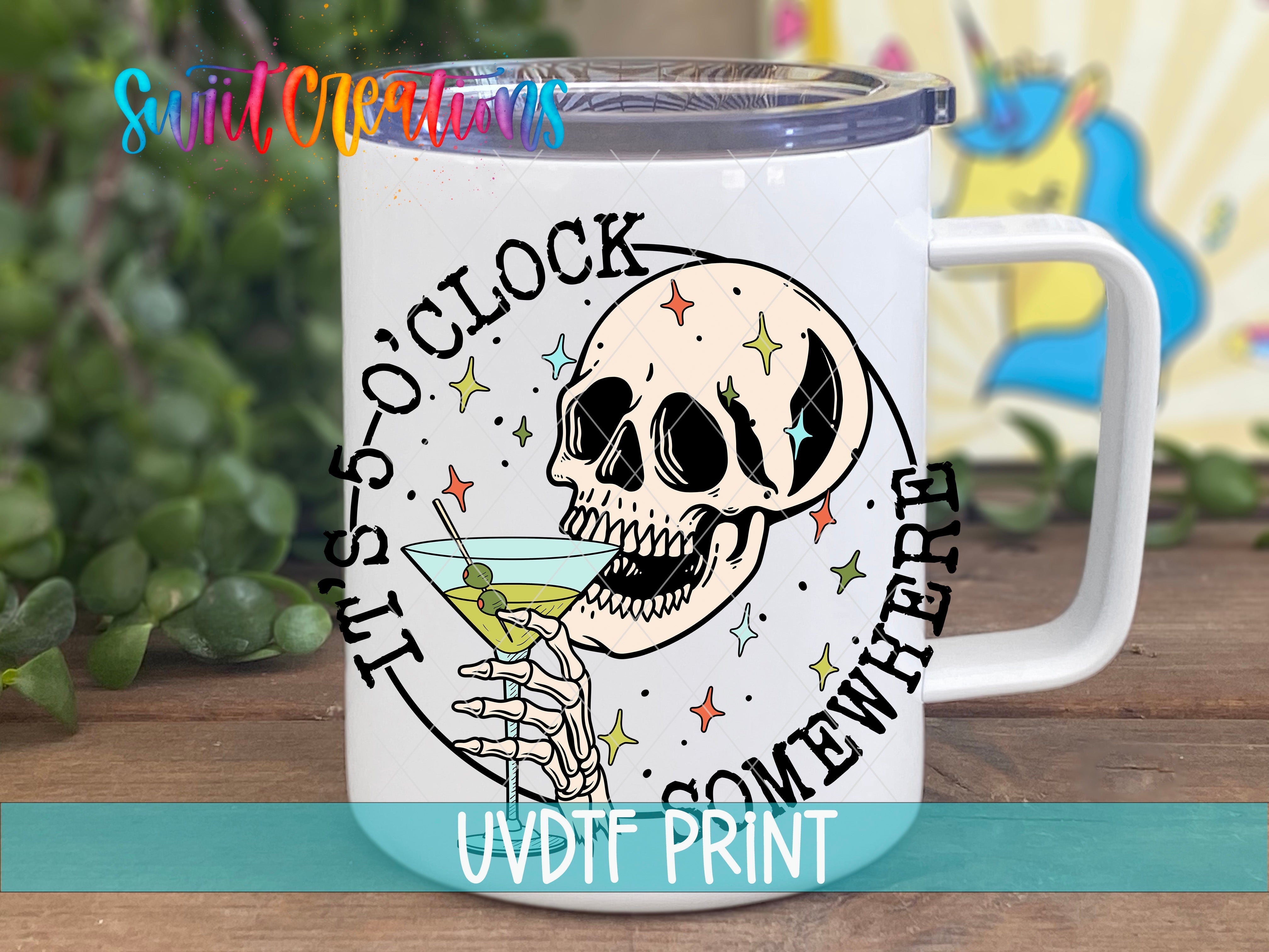 a white coffee mug with a skull holding a martini