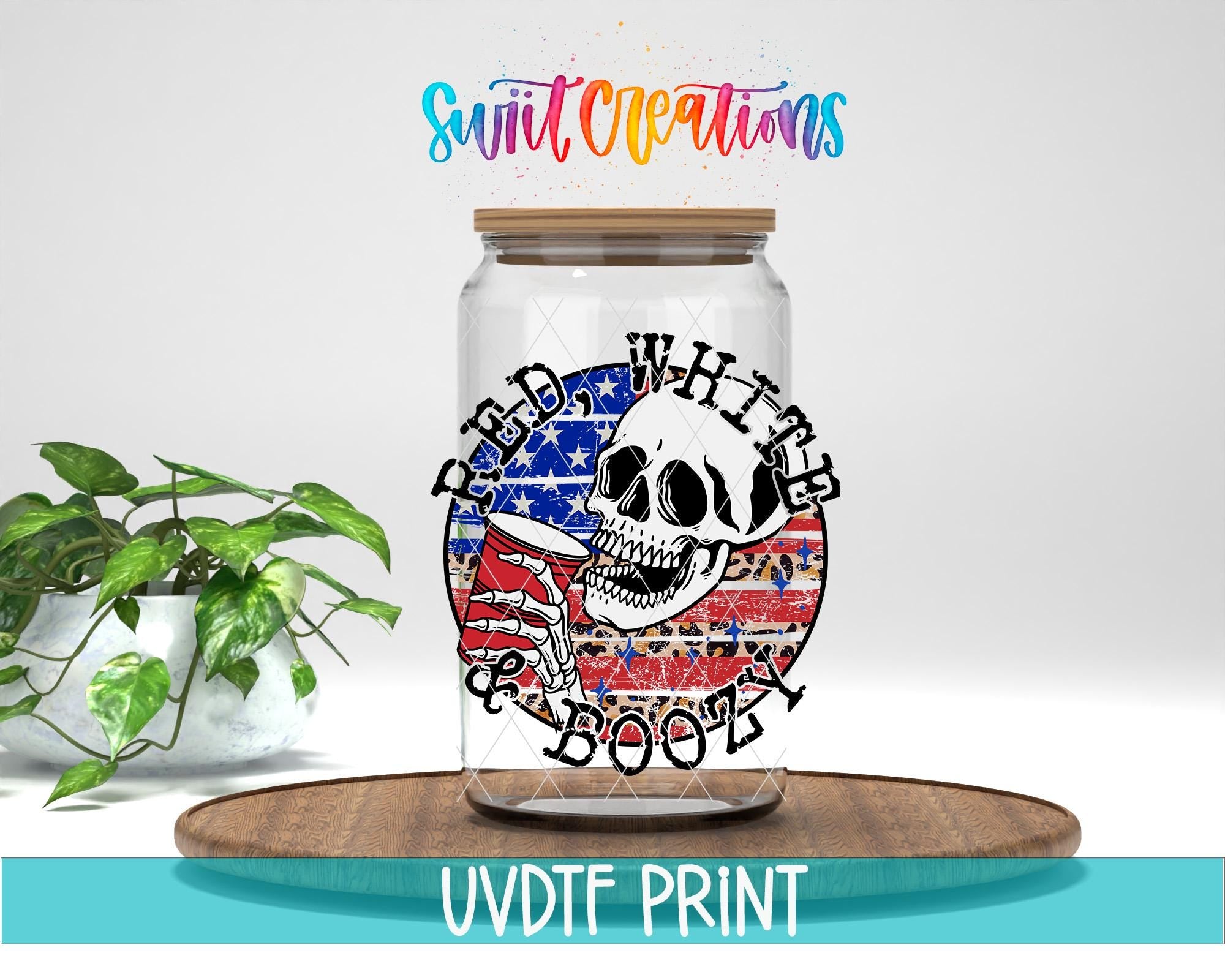 a glass jar with a skull design and the text "RED WHITE BOOT" printed on it, placed on a wooden surface.