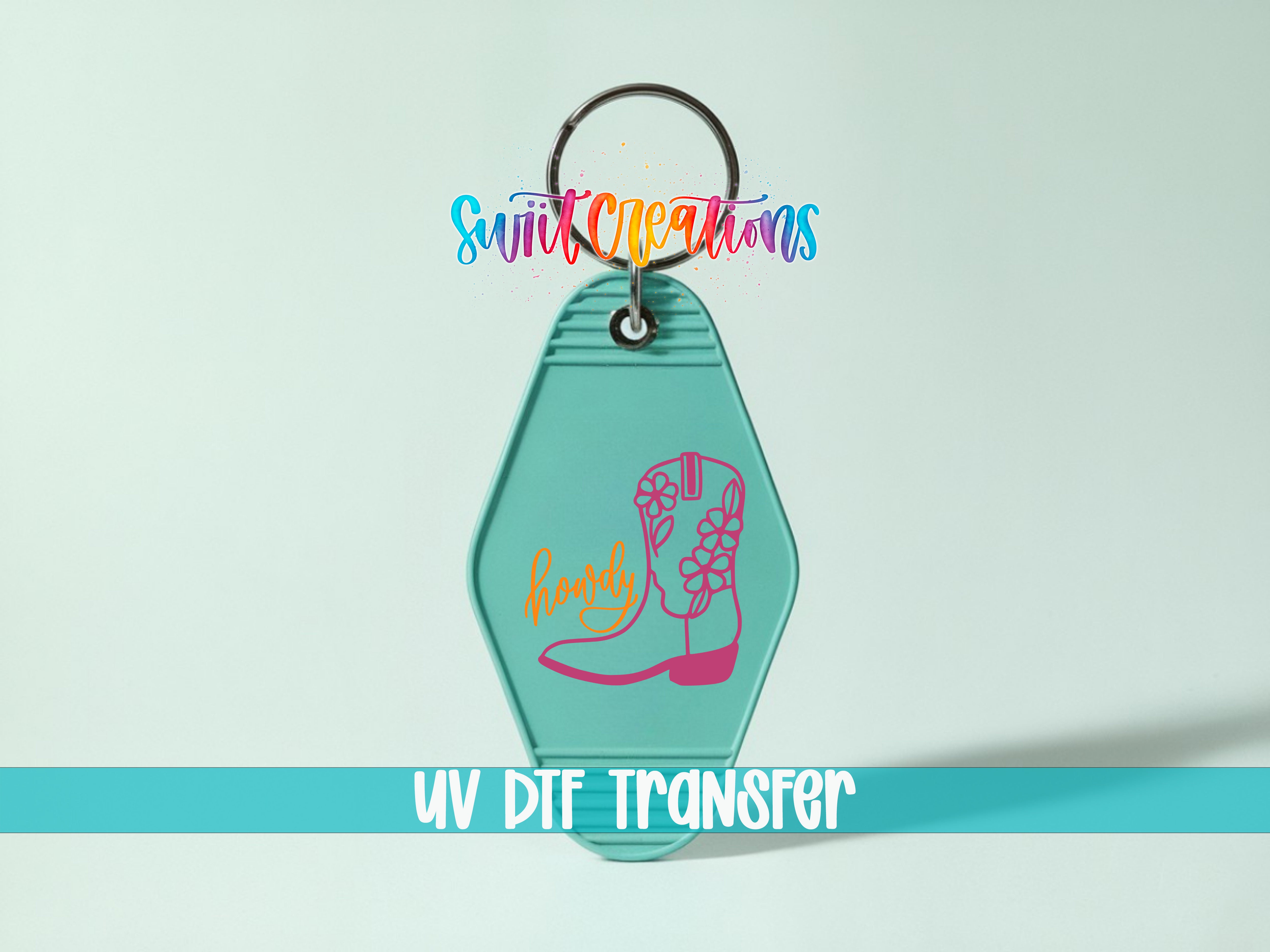 A keychain with a colorful design and the text "UV DIF TRANSFER" printed on it.