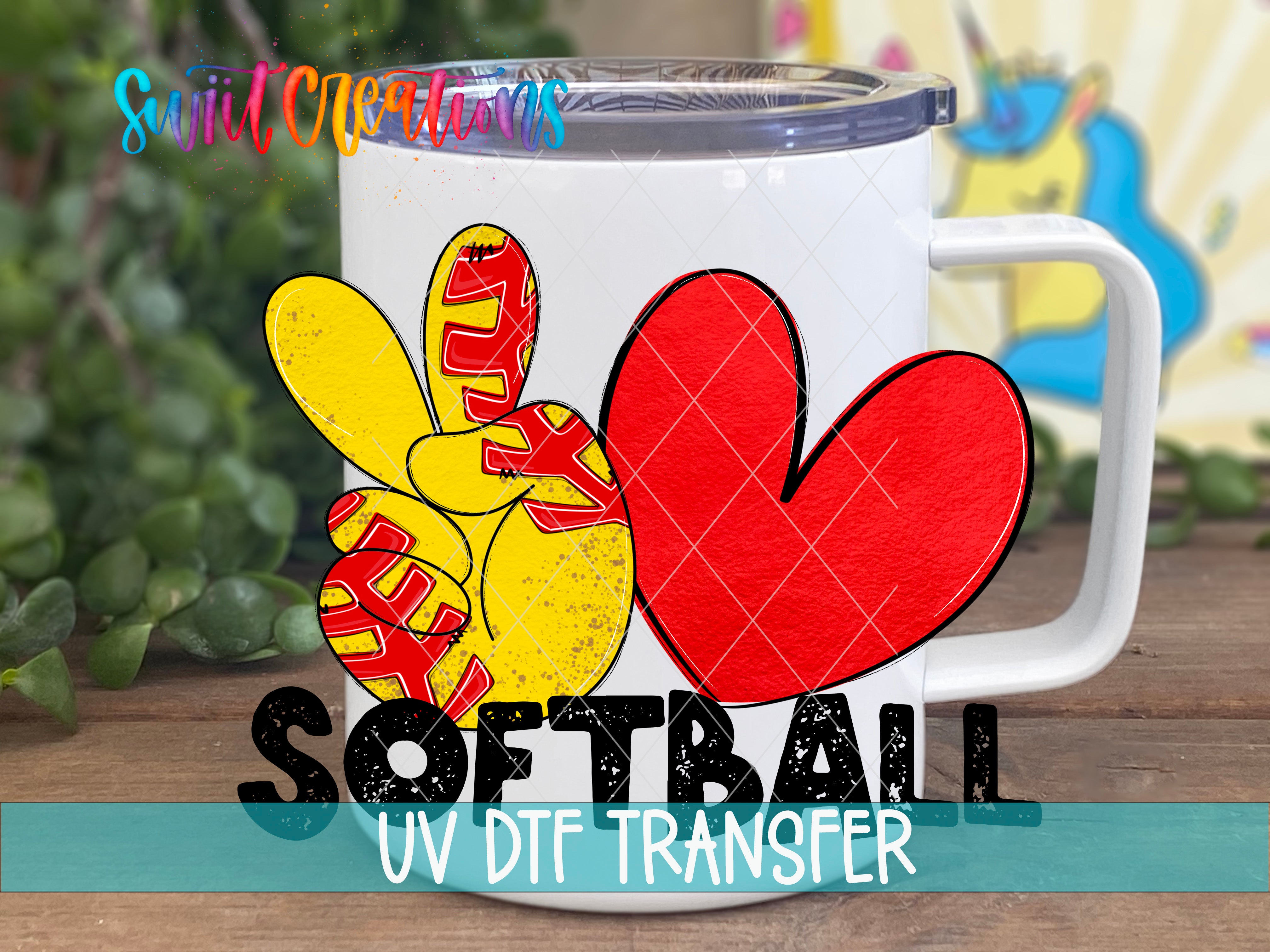 A white mug with a peace sign and a red heart, along with the text "SOFTBALL UV DTF TRANSFER".