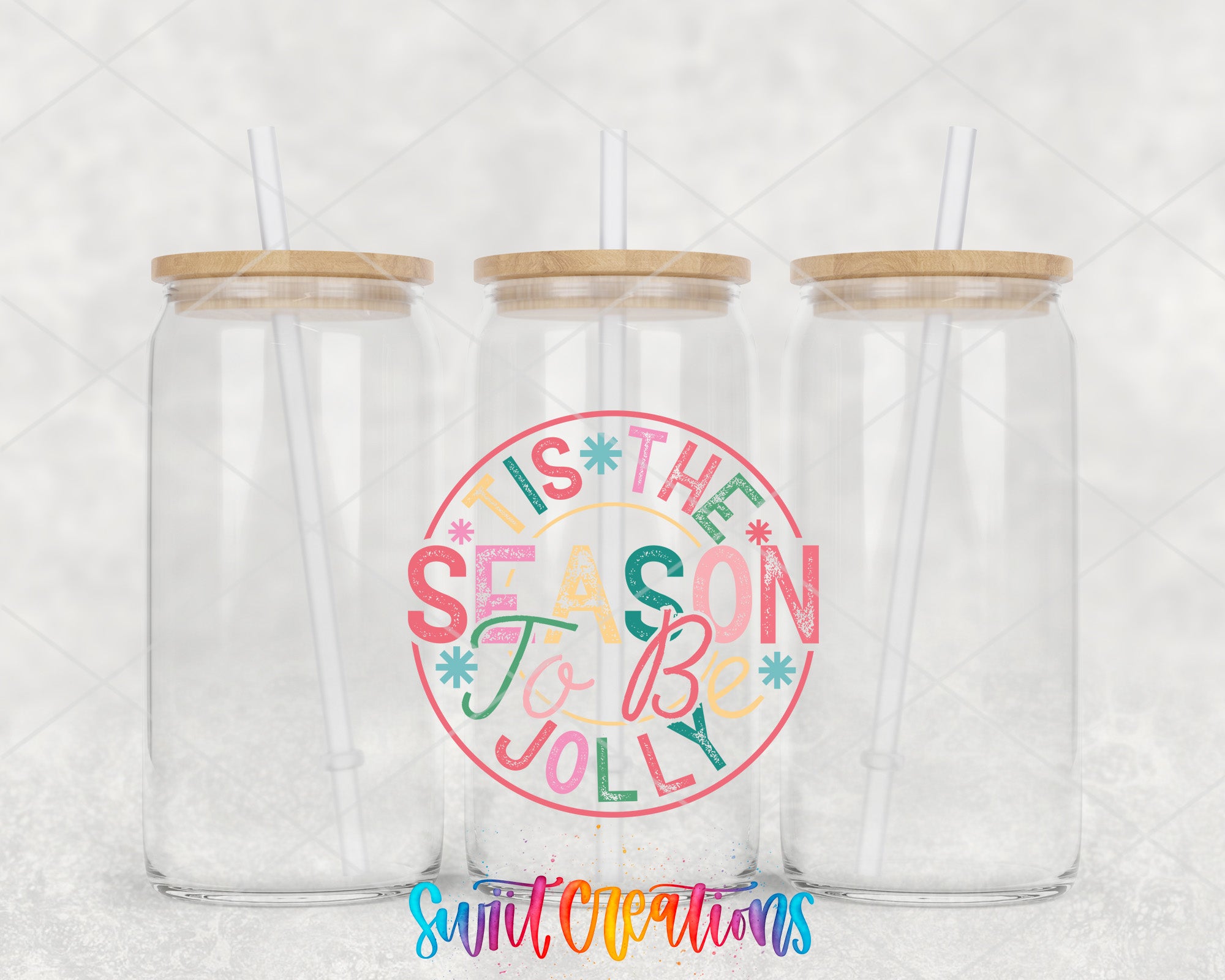 two clear tumblers with wooden lids and straws on a white background