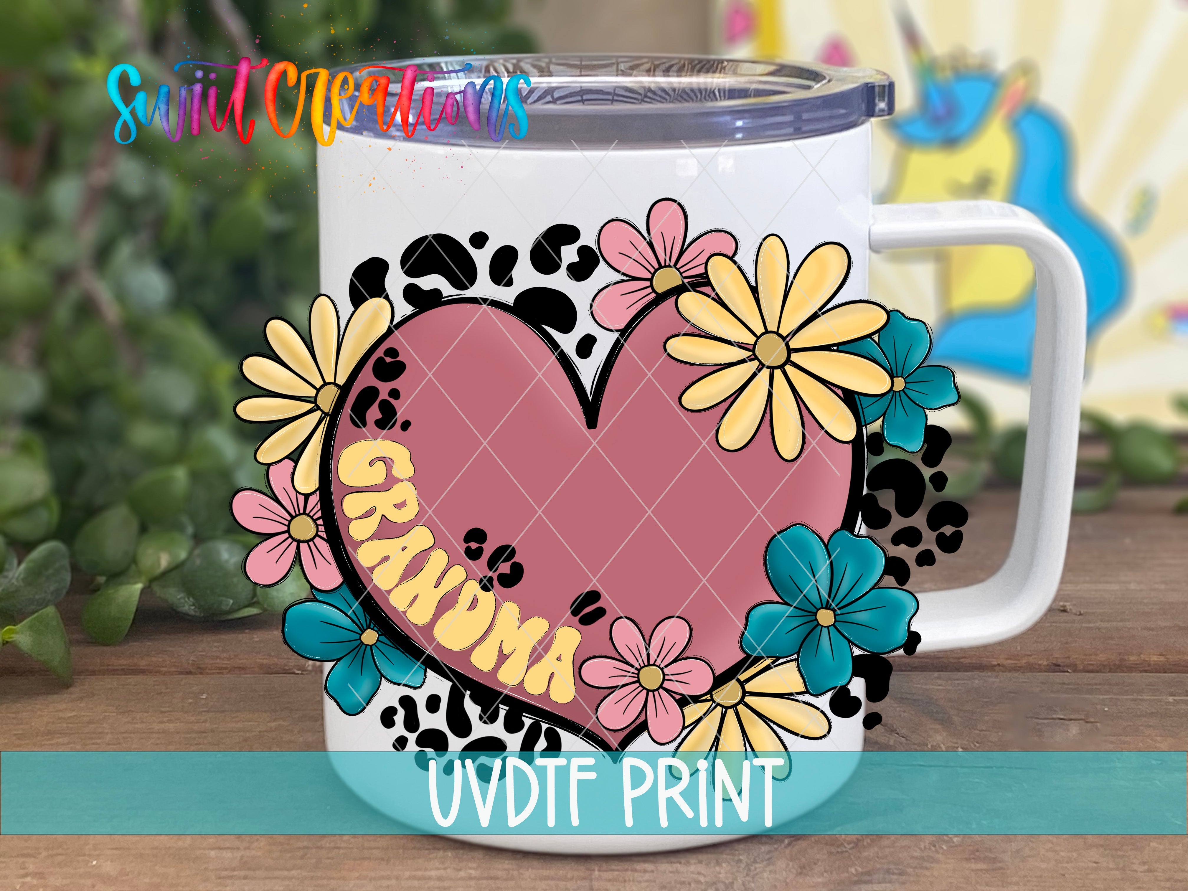 a coffee mug with a heart and flowers on it