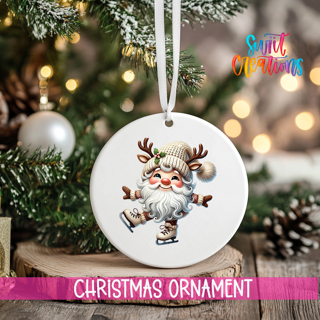 A white Christmas ornament featuring a smiling Santa Claus with antlers is hanging from a tree branch, with a blurred background of twinkling lights and pine cones.