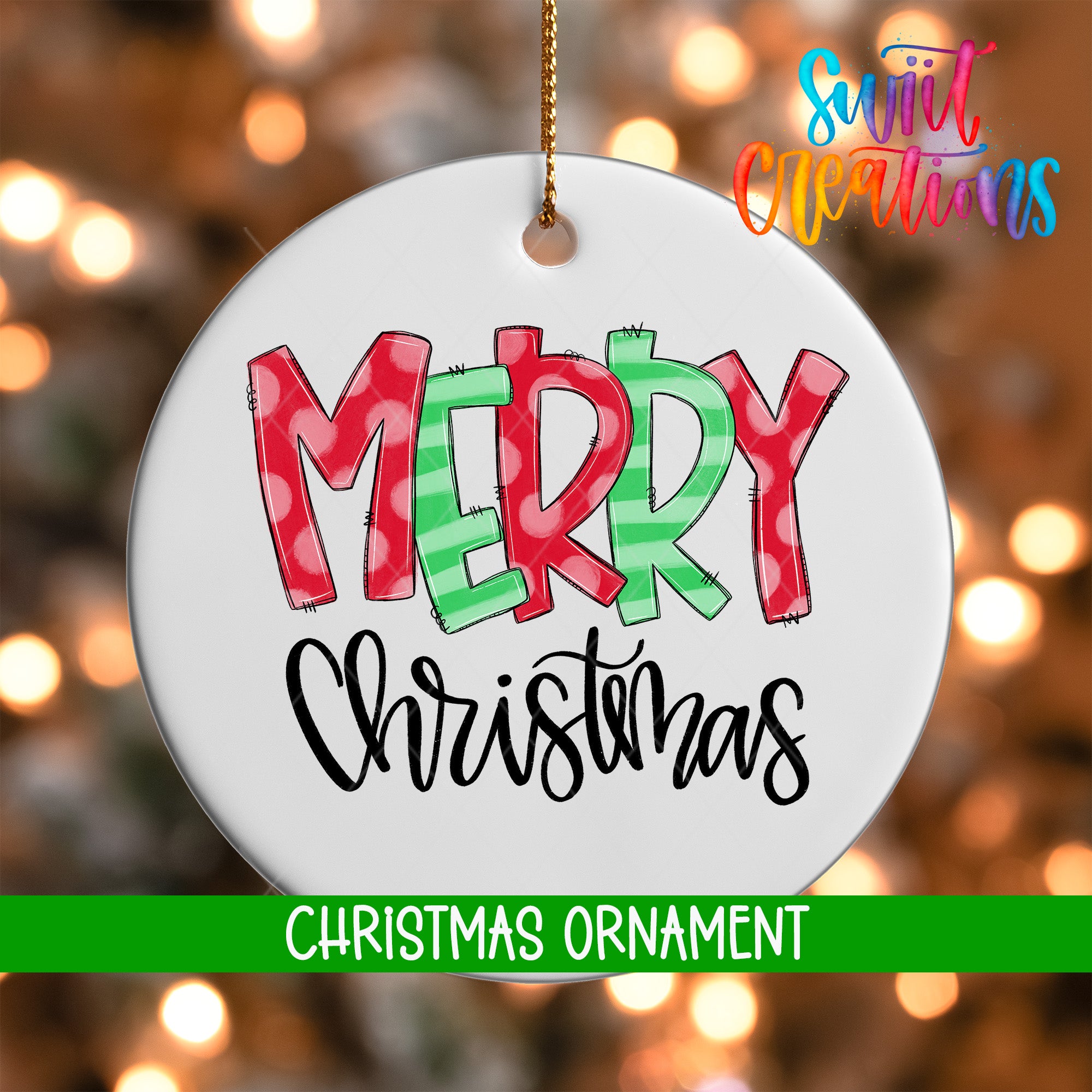 A white Christmas ornament with the text "MERRY CHRISTMAS" written in a colorful, hand-drawn style.