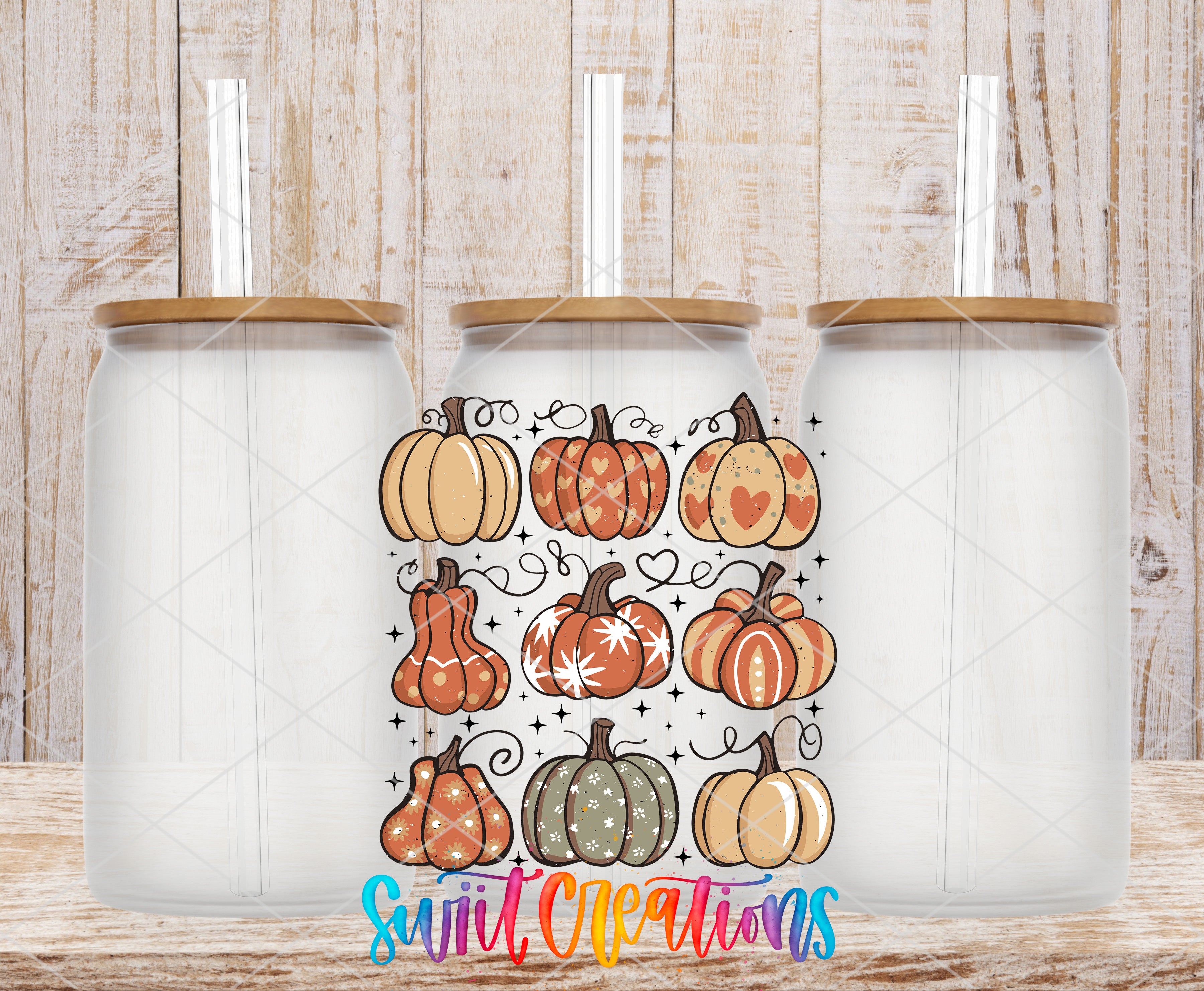 three glass jars with lids, each containing a straw, and a colorful design of various pumpkins and autumn-themed elements.