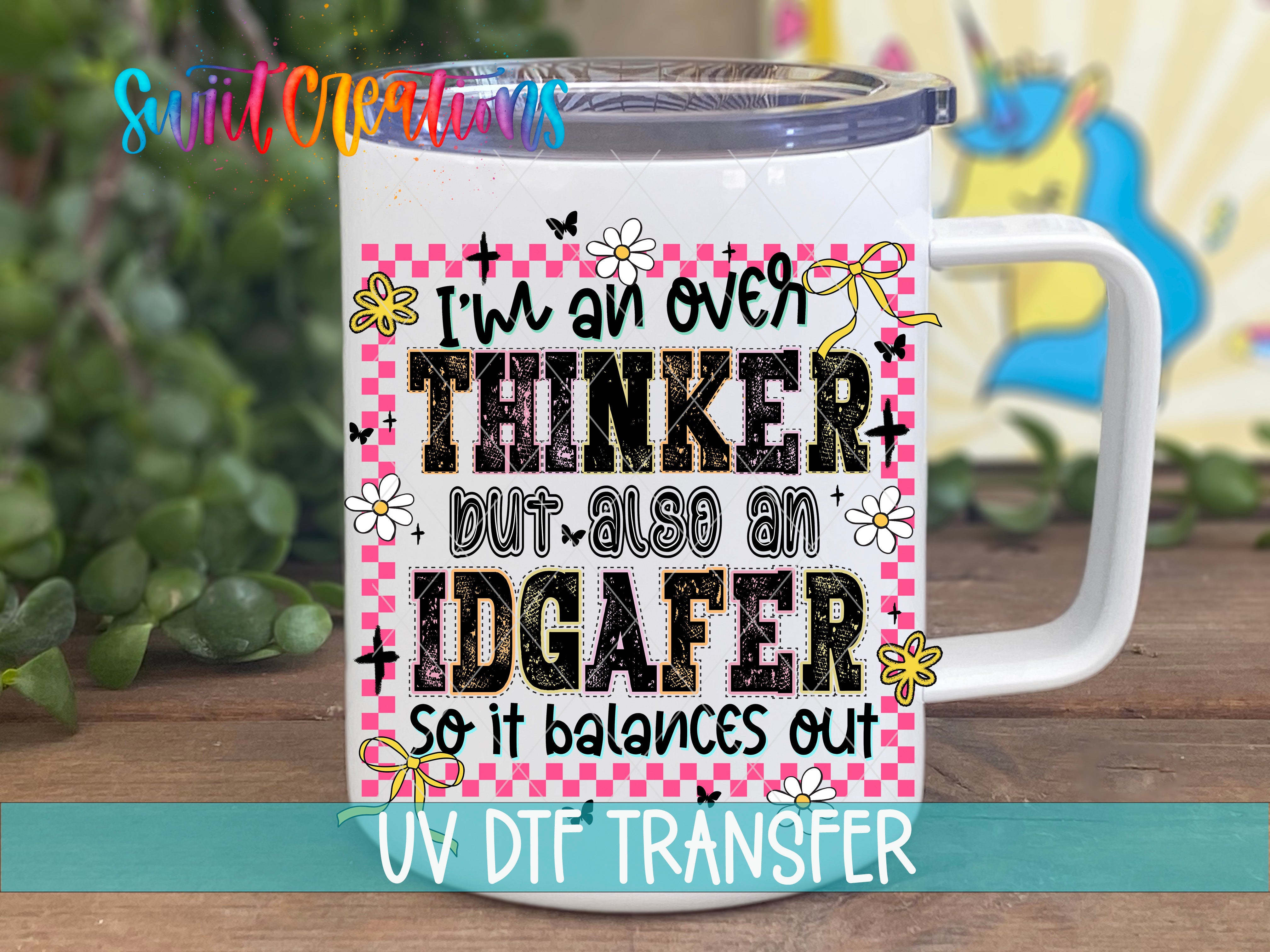 A white mug with a colorful and playful design featuring text and illustrations.