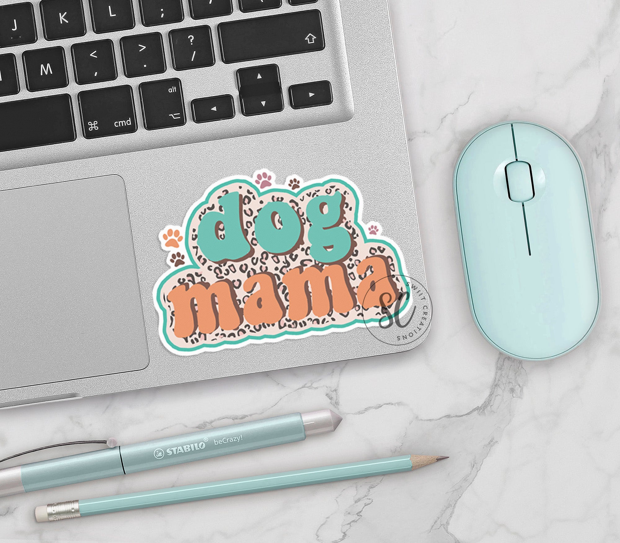 a laptop and a mouse on a table