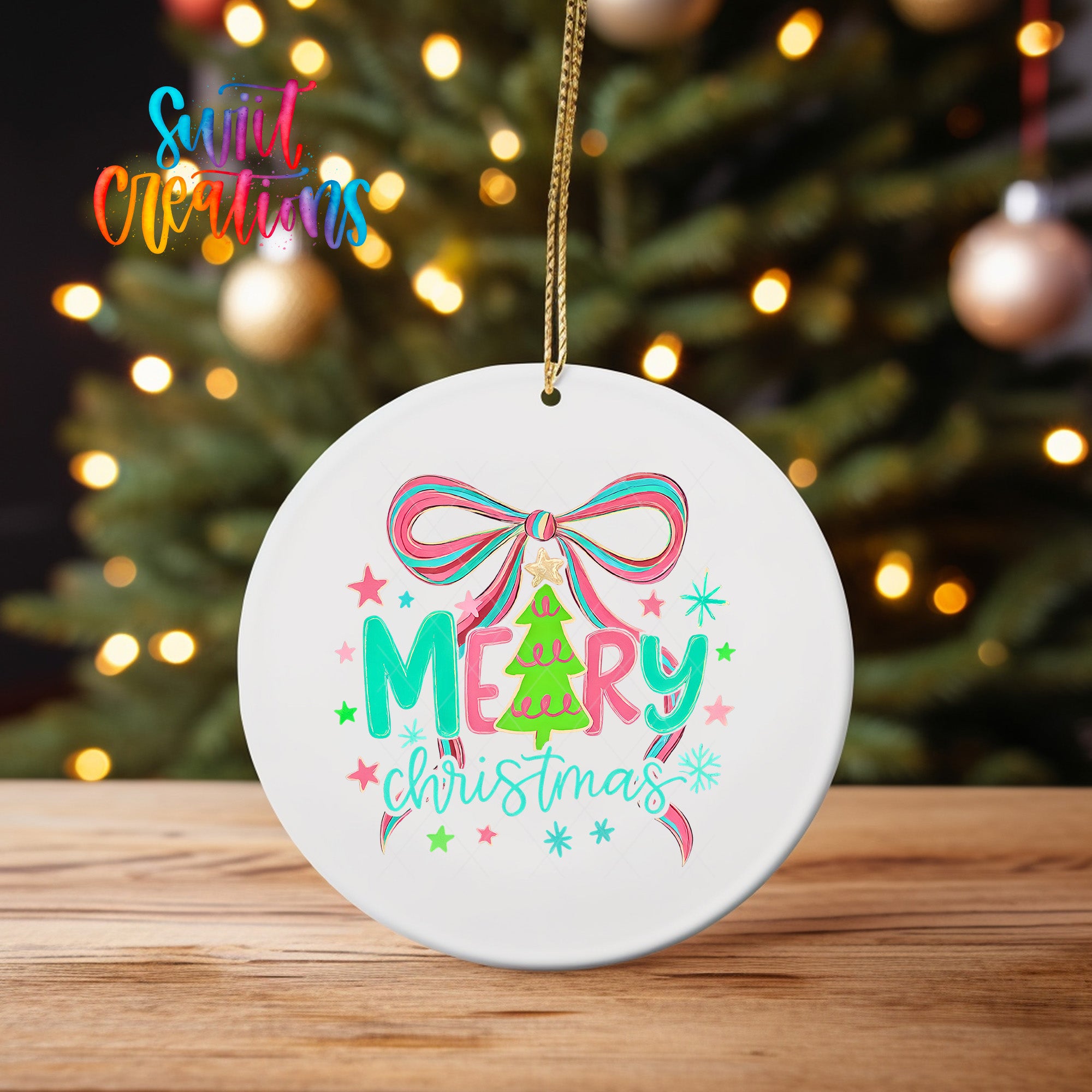 A white Christmas ornament with a bow and the text "Merry Christmas" is displayed on a wooden surface, with a blurred background of a lit Christmas tree.