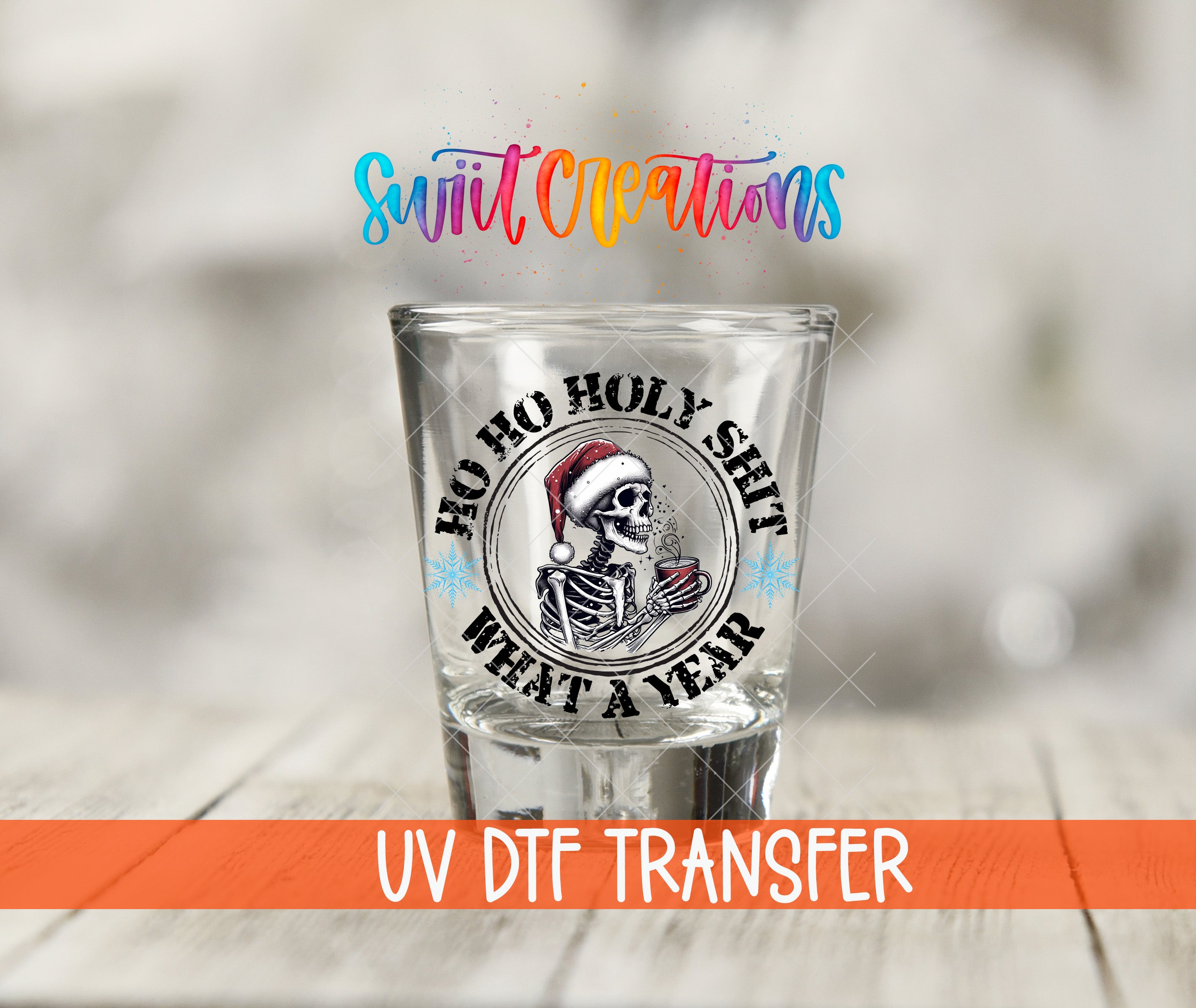 A shot glass with a skull wearing a Santa hat and the text "FOO HO HOLY SHIT WHAT A YEAR" printed on it.