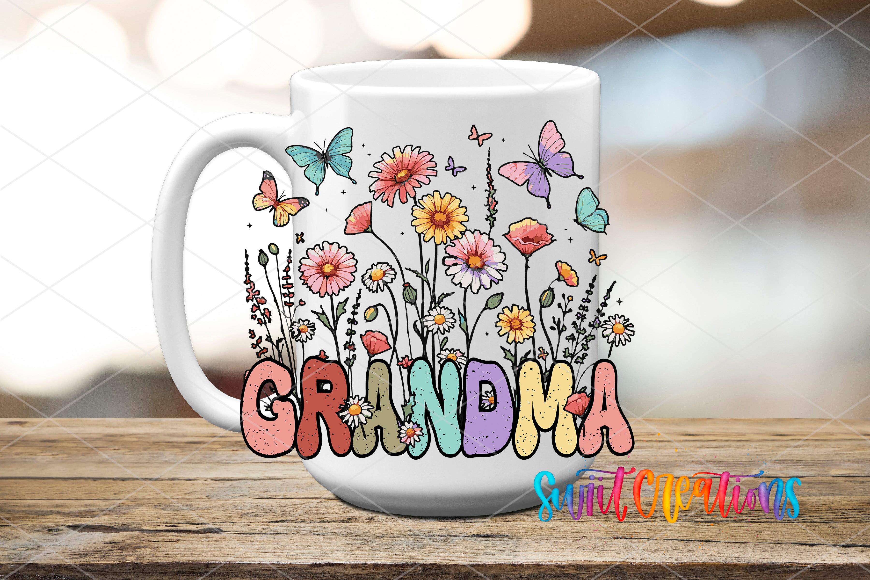 A white ceramic mug with a colorful floral design and the word "GRANDMA" printed on it.