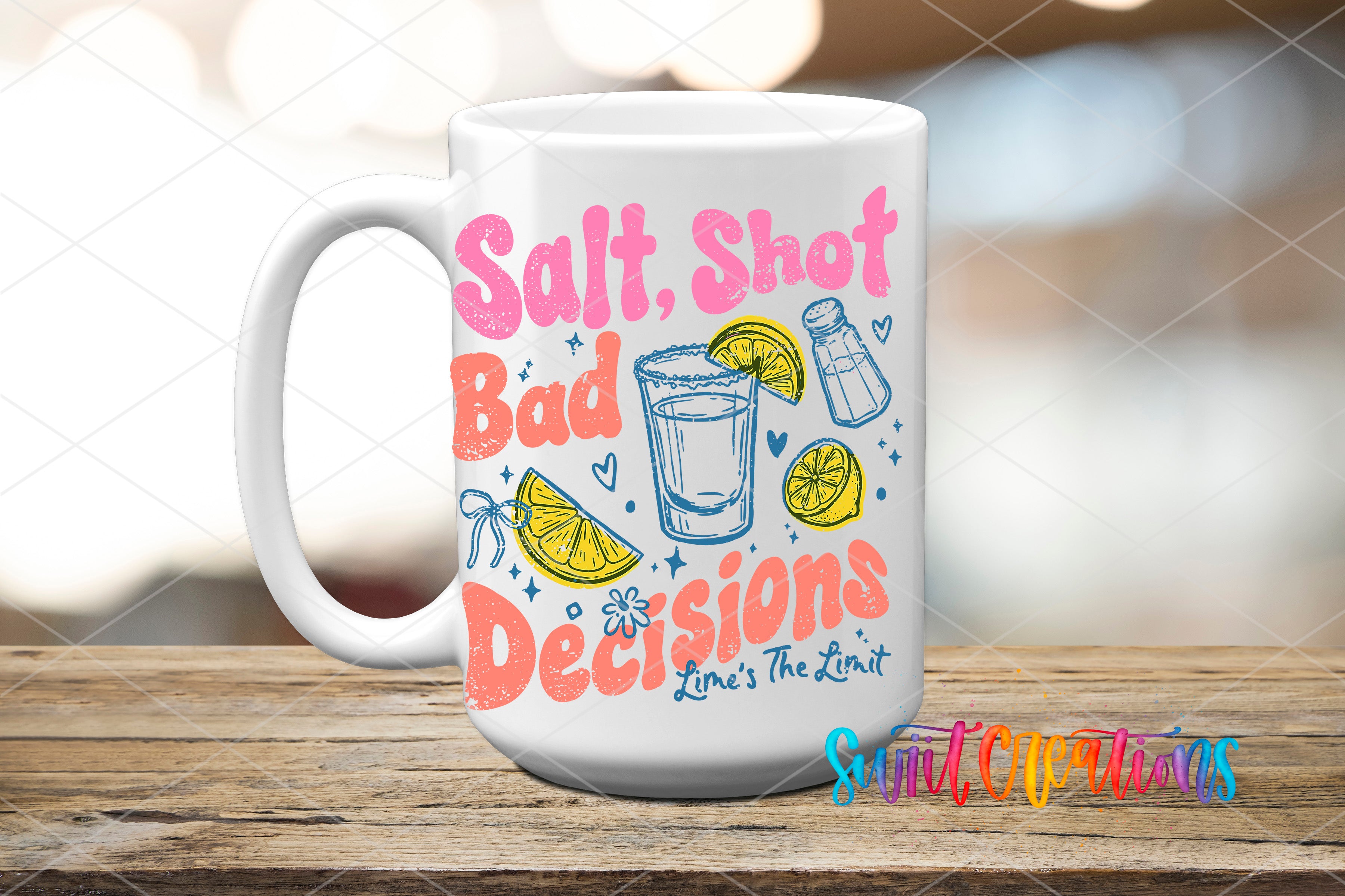 A white mug with colorful text and illustrations on it, placed on a wooden surface.